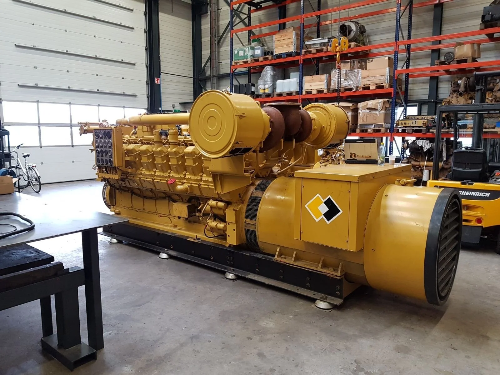 Yellow industrial generator in warehouse