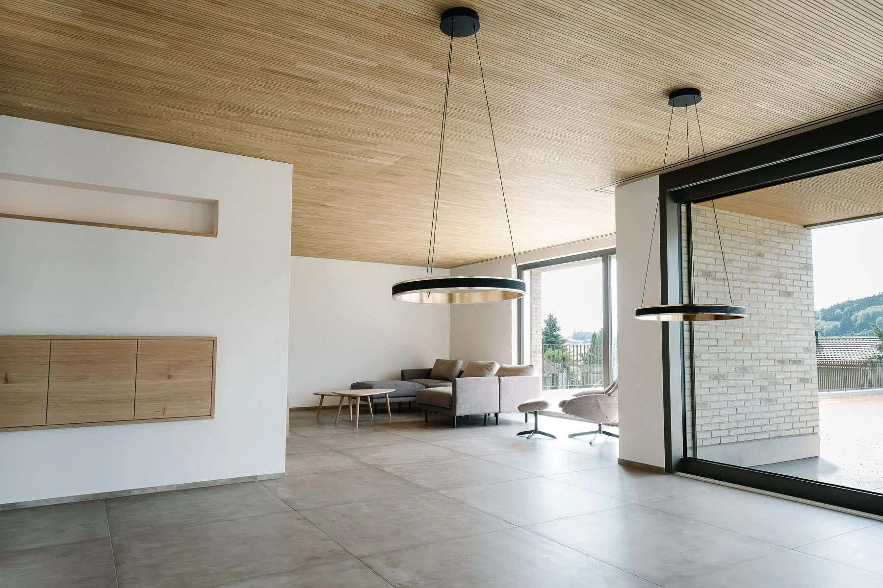 Wohnzimmer Einfamilienhaus Sirnach, Blick zum Sitzbereich