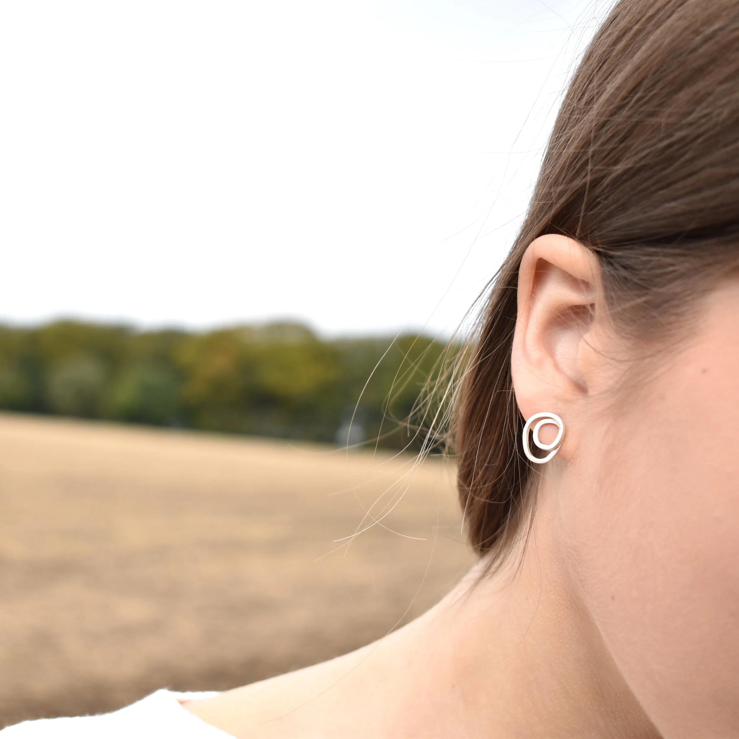 SWIRL studs silver 2.jpg