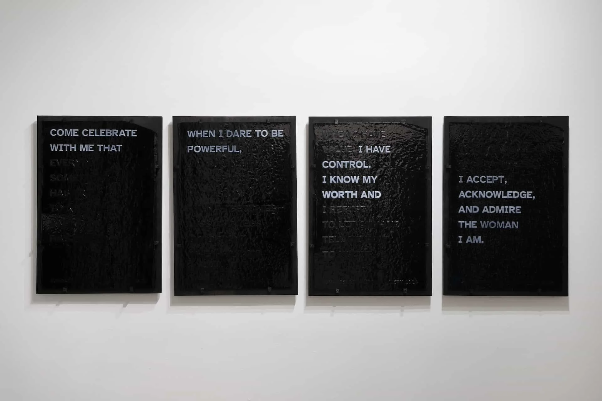 A Constellation of Blackness: Rendering Invisibility, Hypervisibility, Devaluation, and Triumph; (TRIUMPH), 2024. Hand-screenprinted broadsides on stiff black opalescent Bullseye glass, black frit, dense white frit, kiln fired. 20x30” each (set of 4)