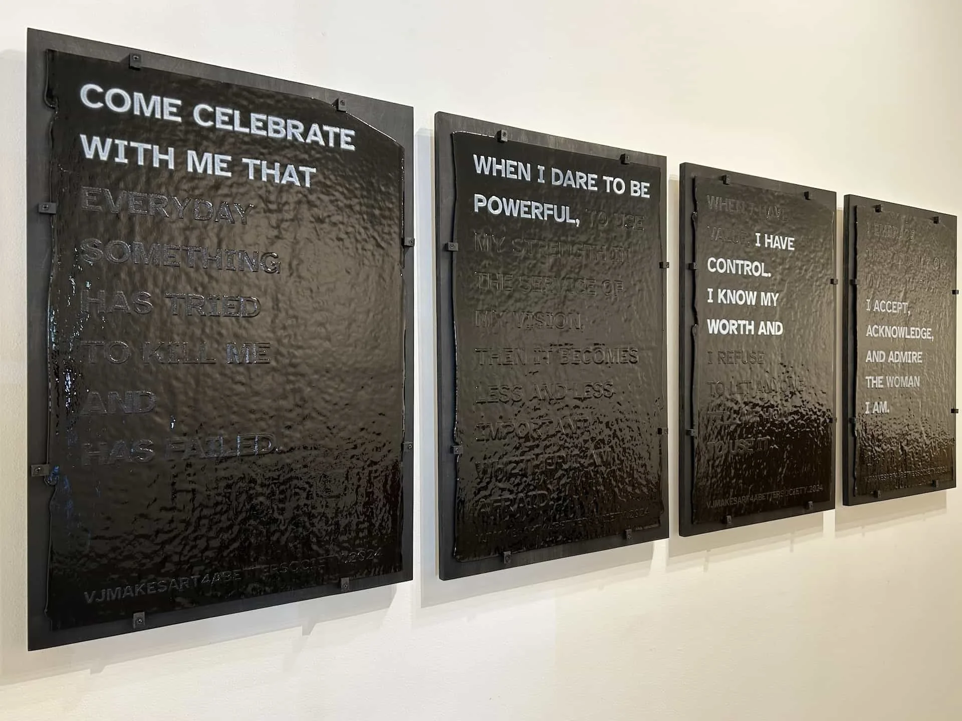 A Constellation of Blackness: Rendering Invisibility, Hypervisibility, Devaluation, and Triumph; (TRIUMPH), 2024. Hand-screenprinted broadsides on stiff black opalescent Bullseye glass, black frit, dense white frit, kiln fired. 20x30” each (set of 4)