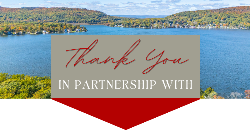 Waterfront landscape with a large lake, trees with fall foliage, and a partly cloudy sky, with a thank you message for partnership overlay.