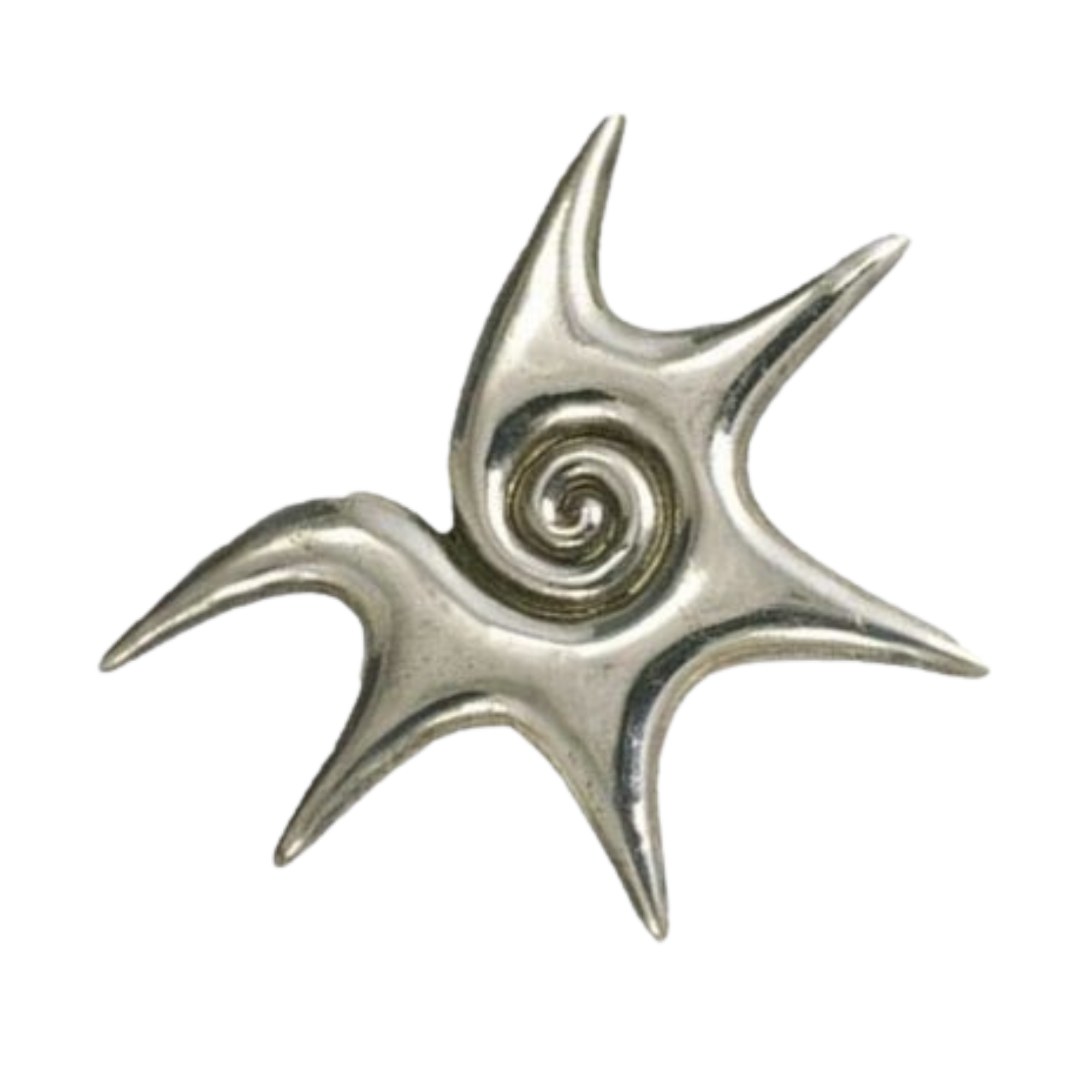 Close-up of a silver decorative object with swirling, curved designs.