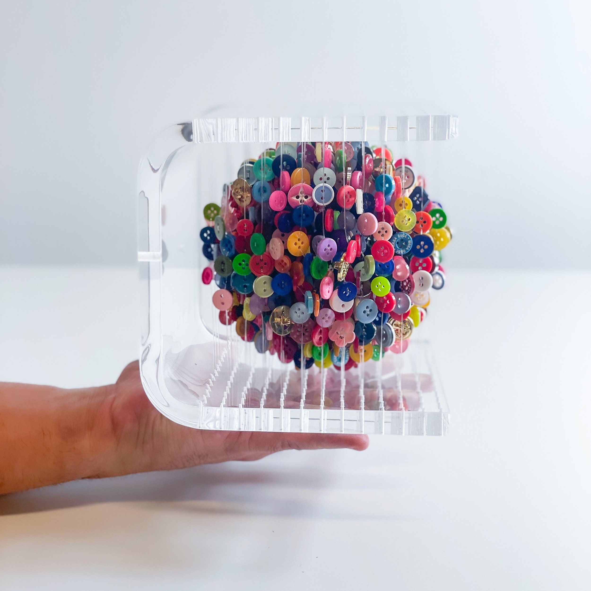 Augusto Esquivel_Multicolored Sphere Hand.jpg