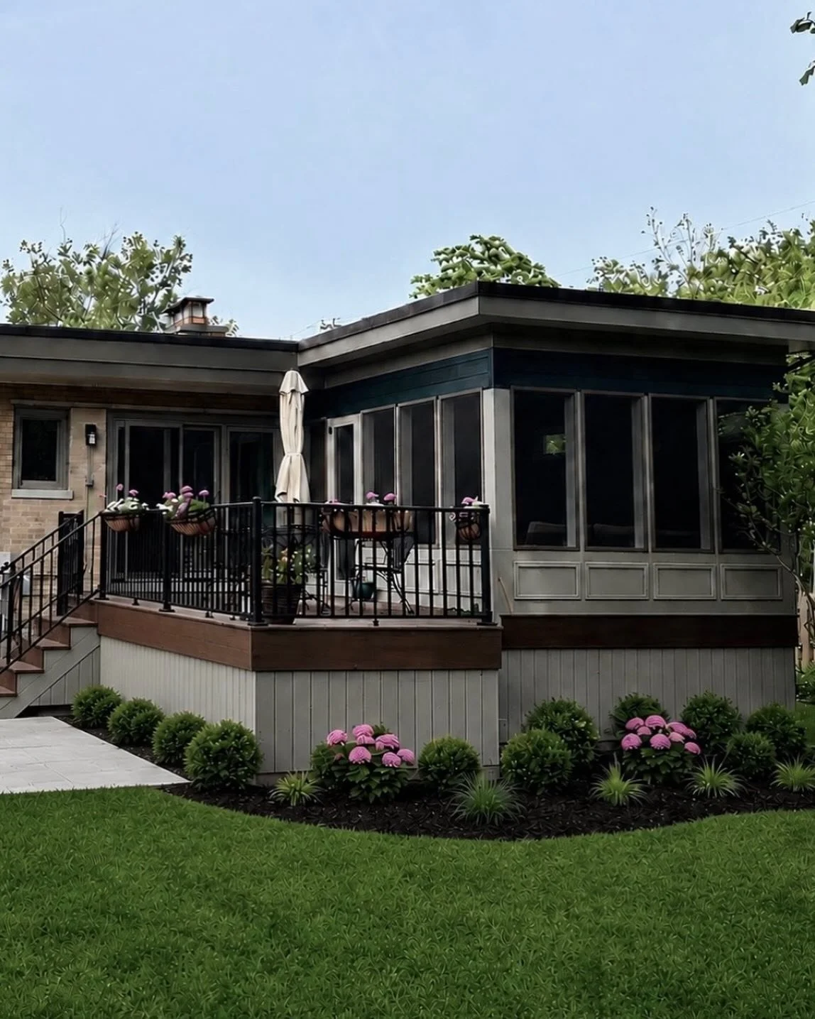 An exterior remodel to a Beverly mid-century modern added a screened- in porch and deck addition.  The design goal was to incorporate its form to both the house&rsquo;s linear roof line while also hugging the broad backyard landscape.  Just in time f
