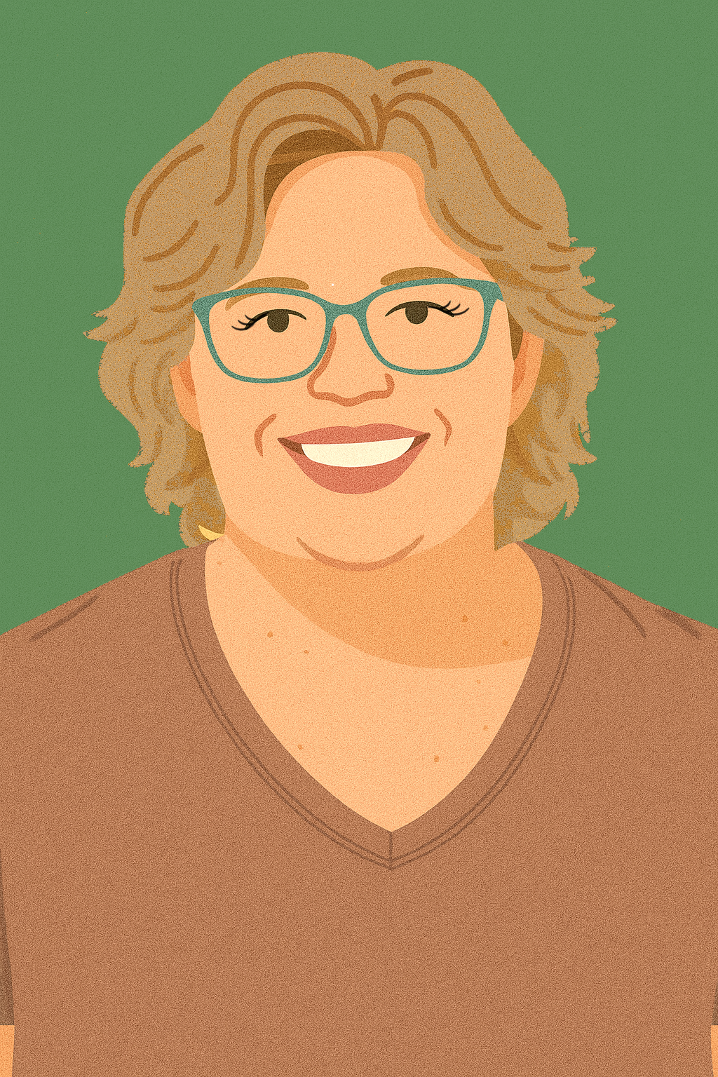 A person with short, light brown hair and glasses smiling, wearing a pastel-colored plaid shirt, standing in front of a beige brick wall.