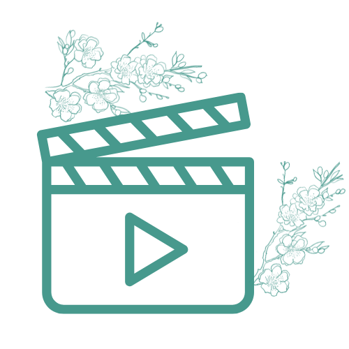 Icône d'un clap de cinéma avec des fleurs décoratives et un bouton de lecture