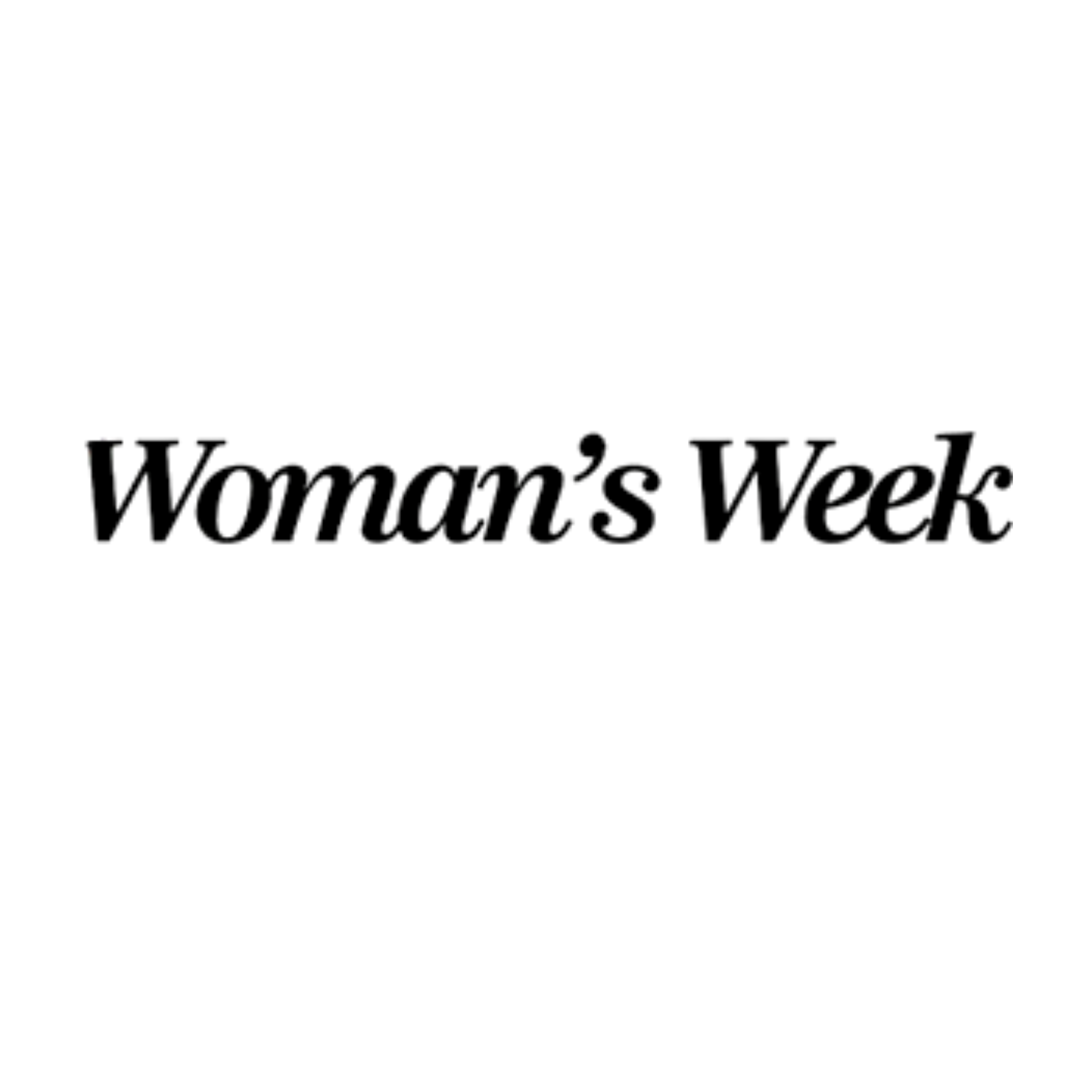 Wide view of a city skyline at night with illuminated skyscrapers and buildings along the waterfront.
