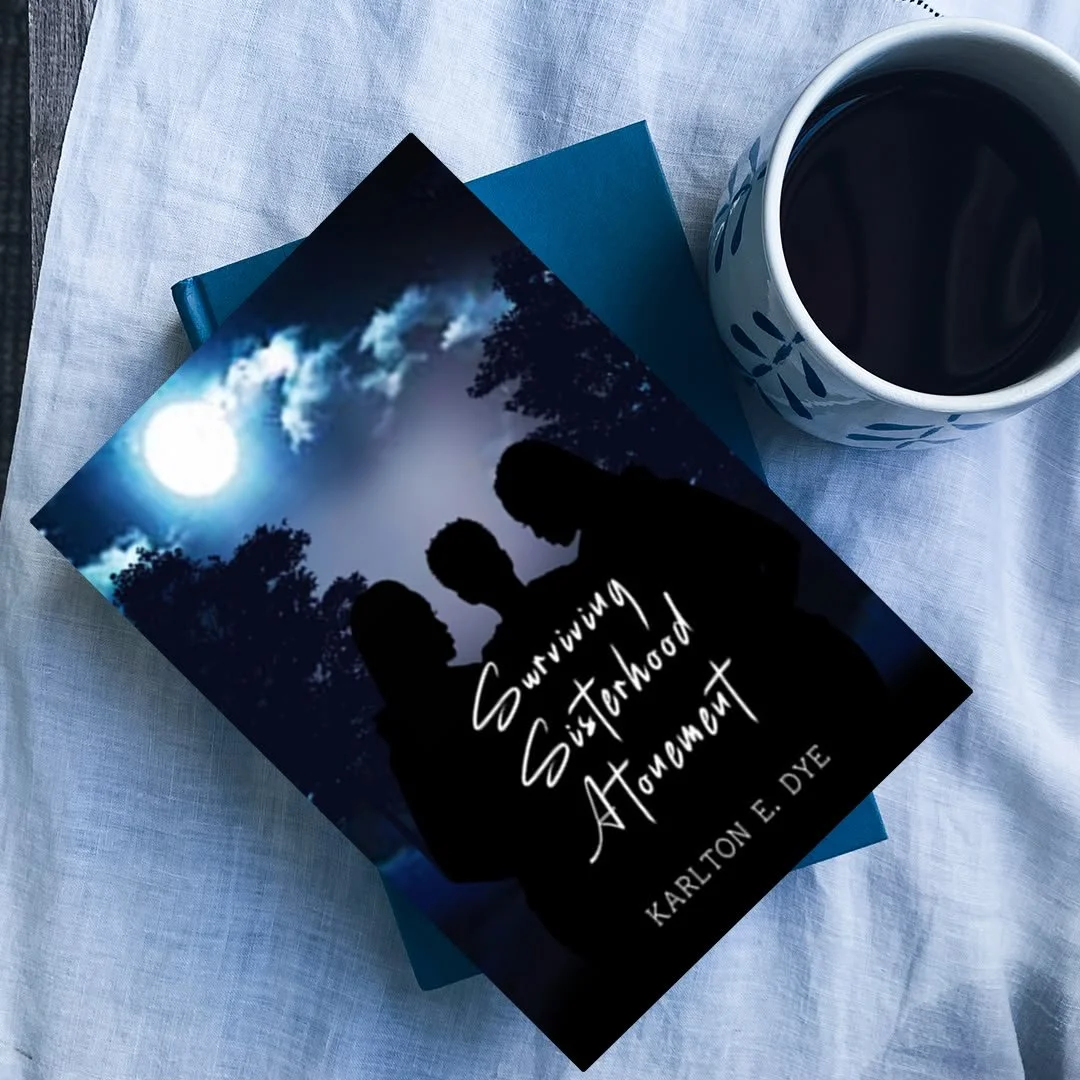 A book titled "Surviving Sisterhood At Arm's Length" by Karlton E. Dye, placed on a blue cover with a mug of black coffee beside it, on a white cloth surface.
