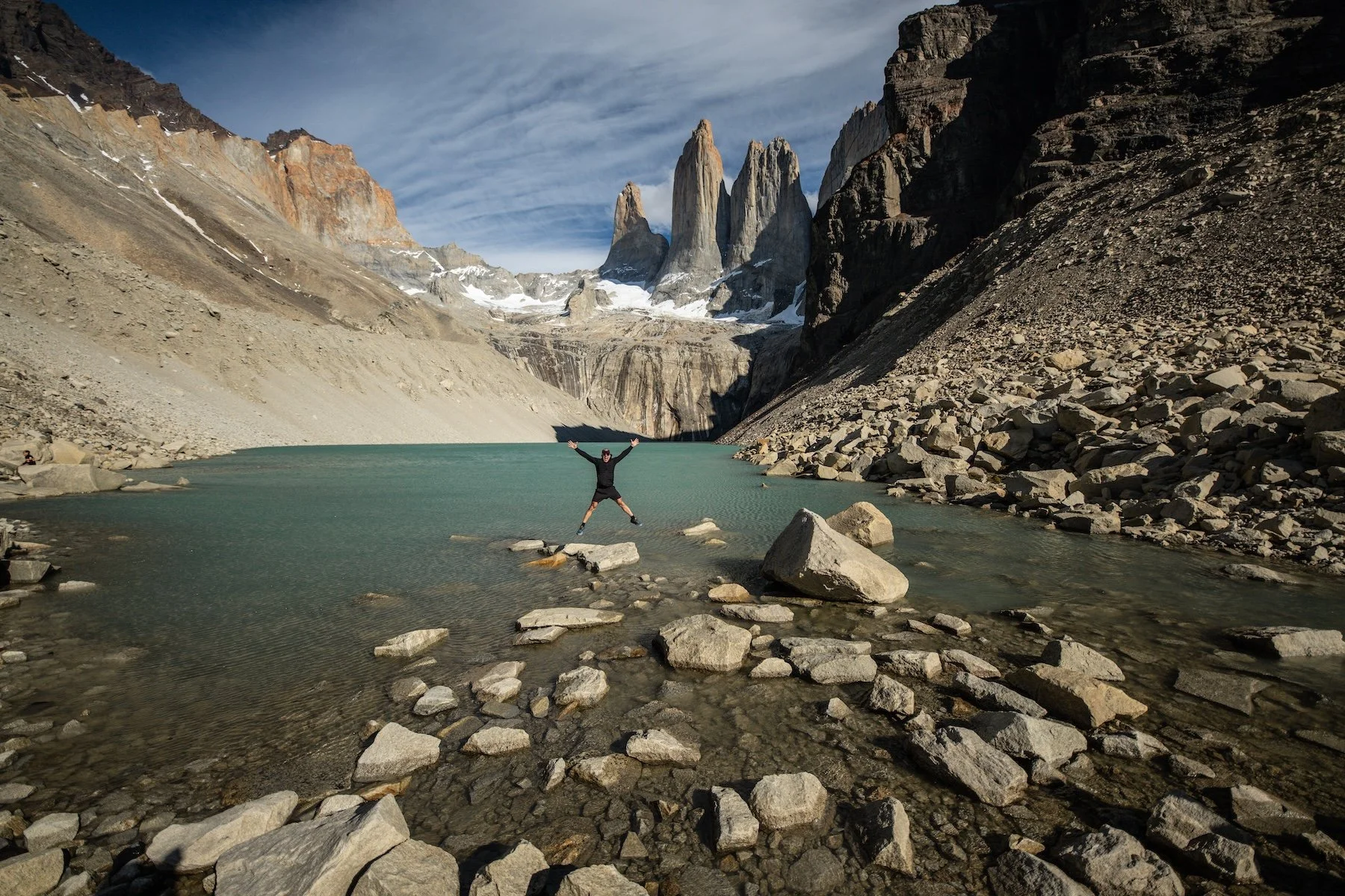 Hiker at the Base of the Towers lagoon, Torres del Paine National Park, Chilean Patagonia