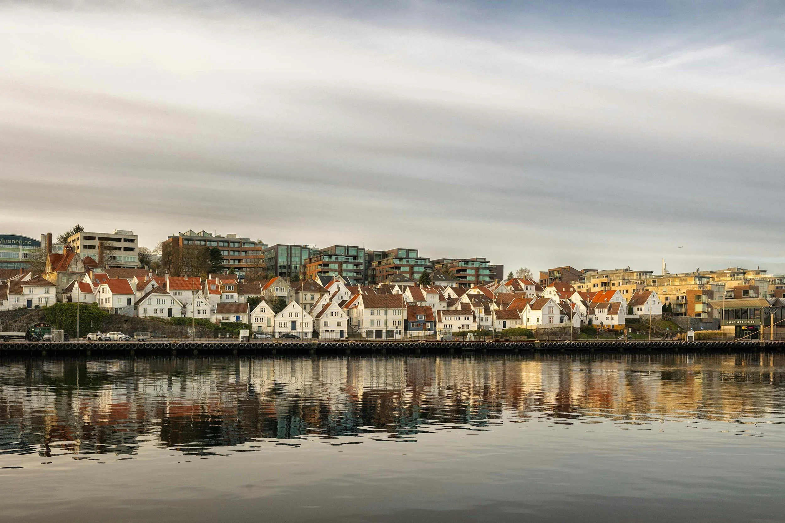 The Stavanger waterfront reflected in the harbour at dusk