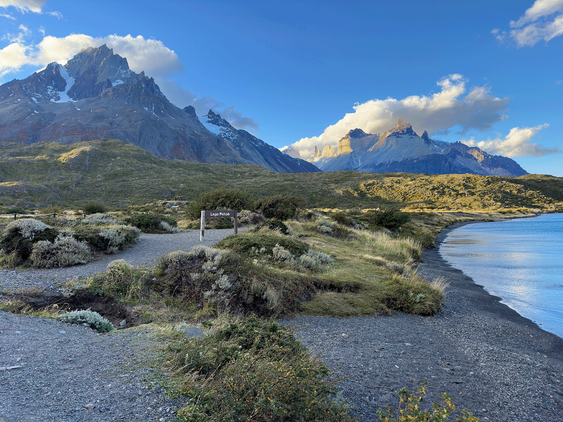 The Cuernos del Paine rising above the turquoise shoreline of Lago Pehoe in Torres del Paine National Park, Chile