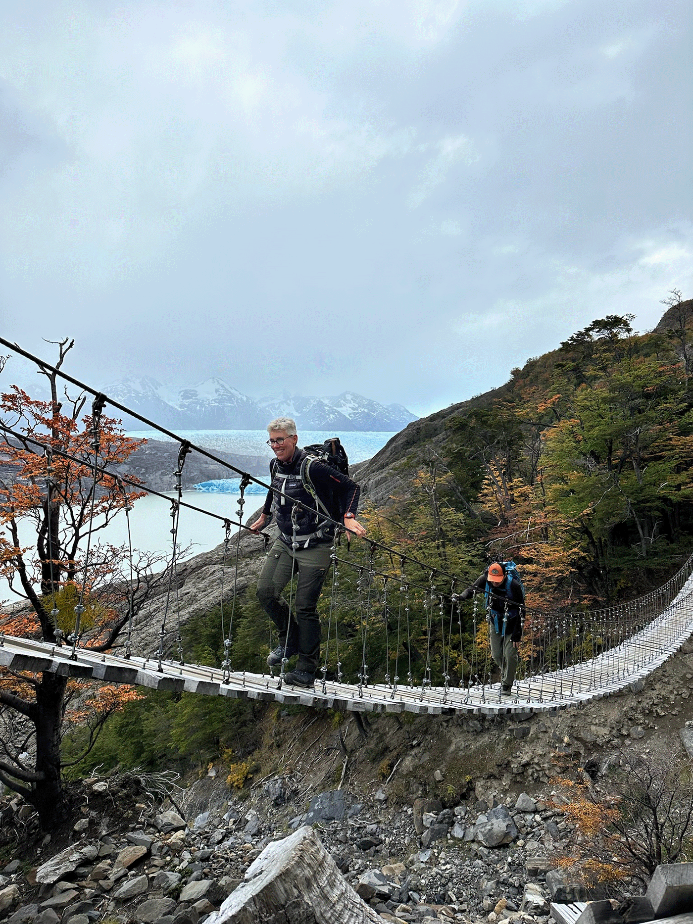 A trekker on the Grey Glacier suspension bridge