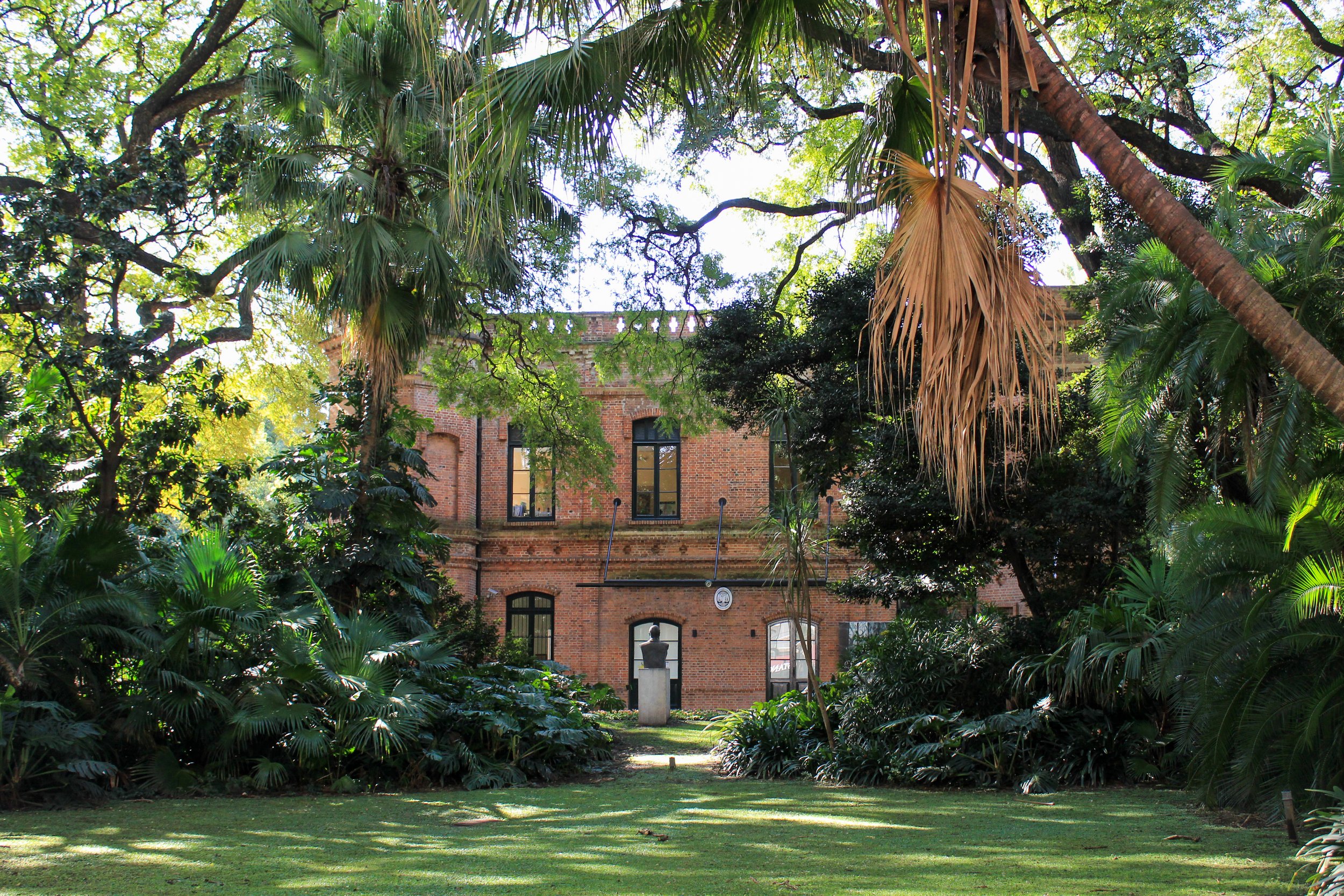 Brick building among tropical gardens in Buenos Aires, Argentina