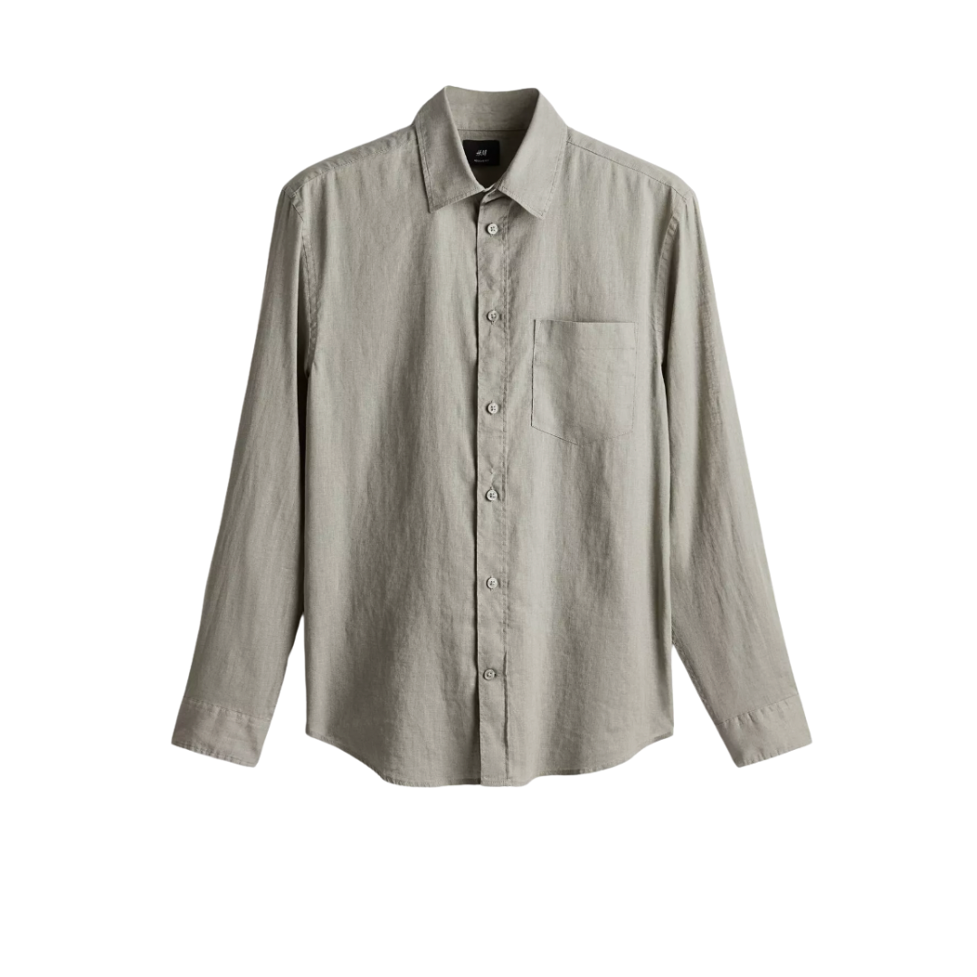 Beige long-sleeve button-up shirt with a chest pocket, displayed on a plain background.