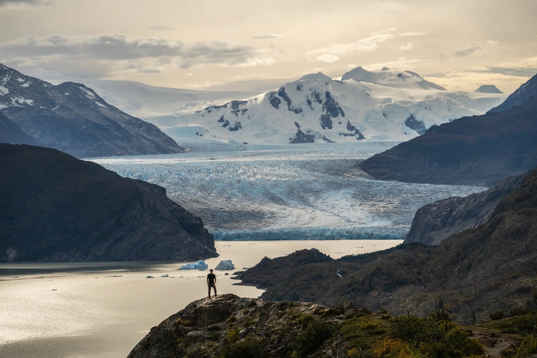 Hiker above Grey Glacier and Grey Lake on the W Trek, Torres del Paine, Patagonia