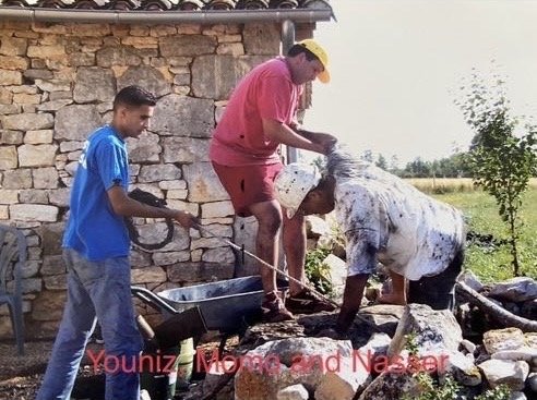 Momo and his helpers clean out the well at Pech Menal