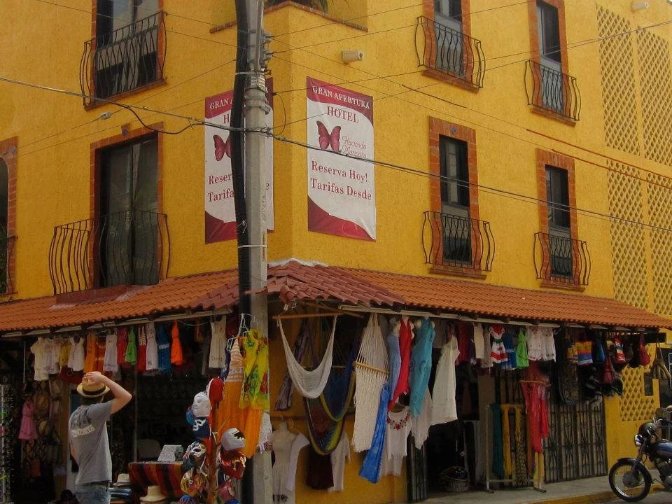 Man standing, looking at a building in Mexico