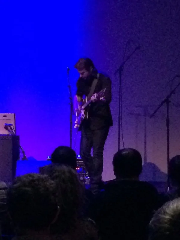 Man performing music on stage