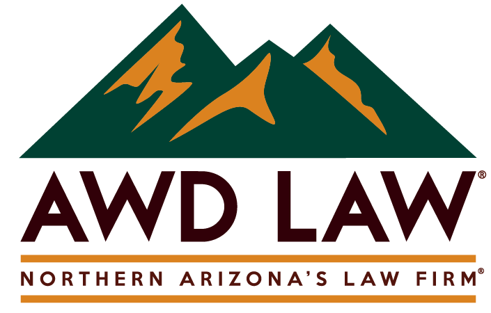 Logo featuring stylized mountains with text 'AWD LAW' and 'Northern Arizona's Law Firm'.
