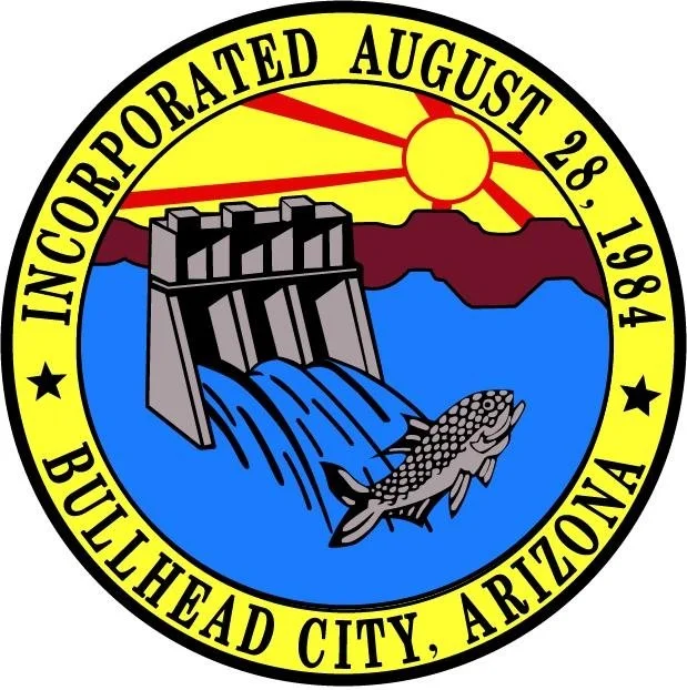 Seal of Bullehead City, Arizona, with a depiction of a dam releasing water, a fish jumping out of water, and a sunrise or sunset, along with the text "Incorporated August 28, 1984"