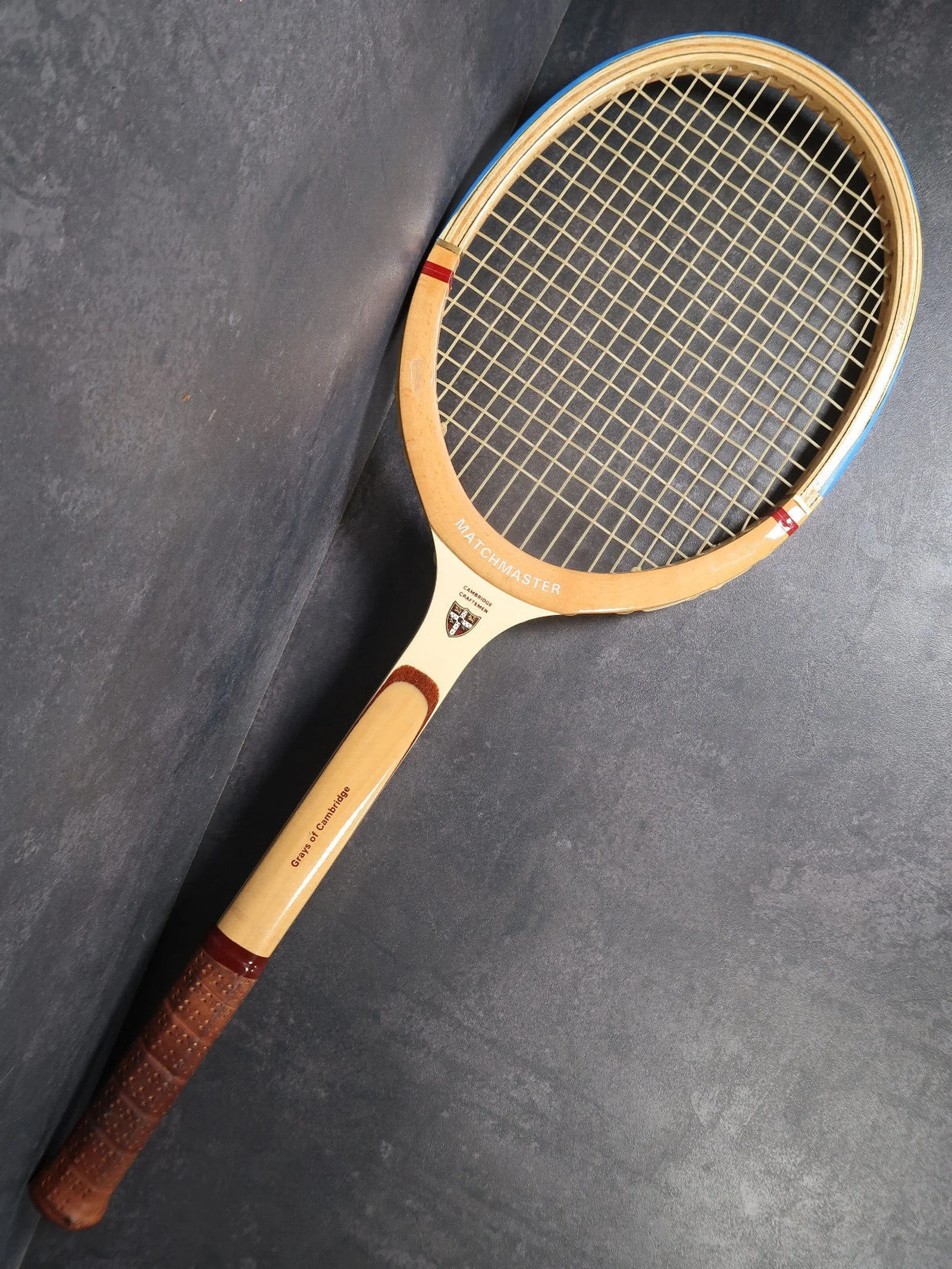Heritage Grays racket against a grey background.