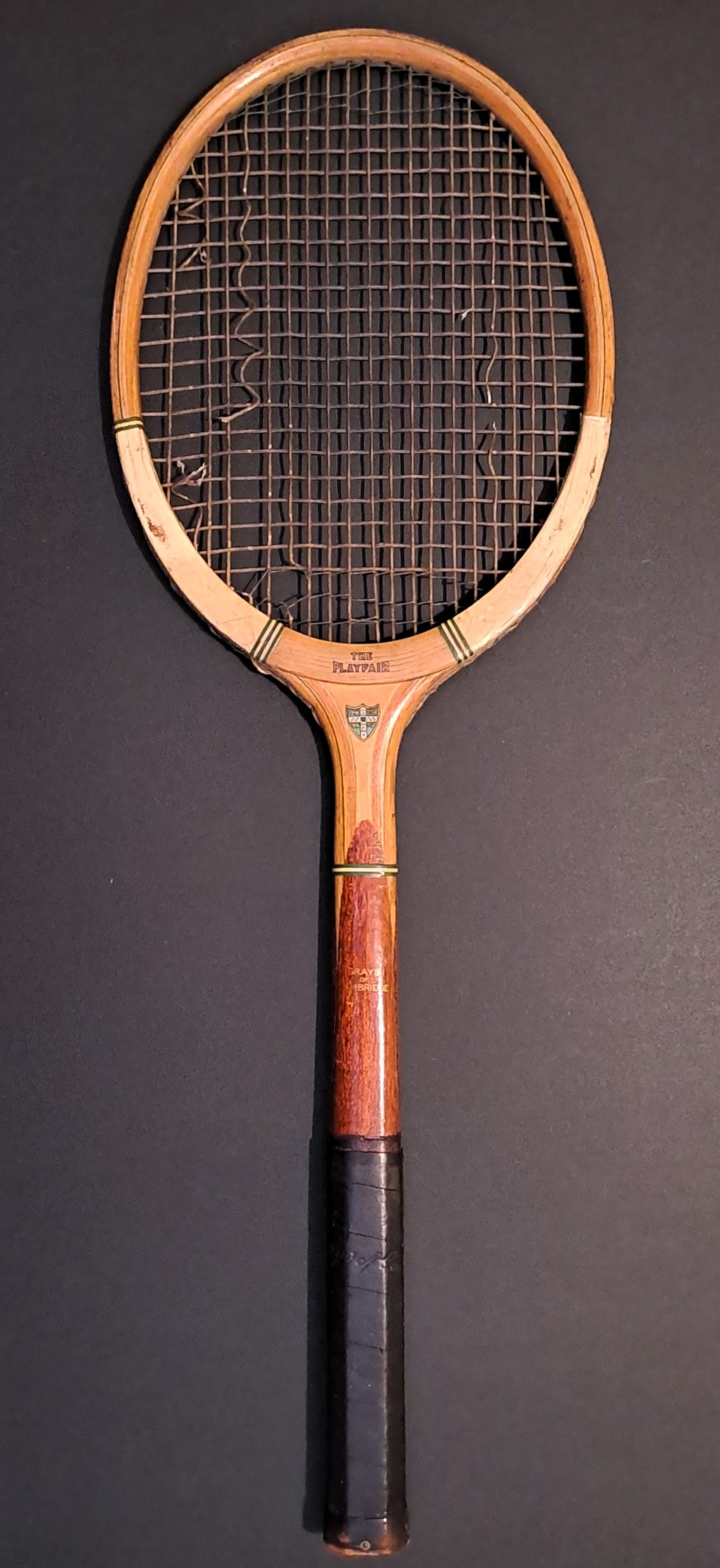 Vintage Grays racket against black background