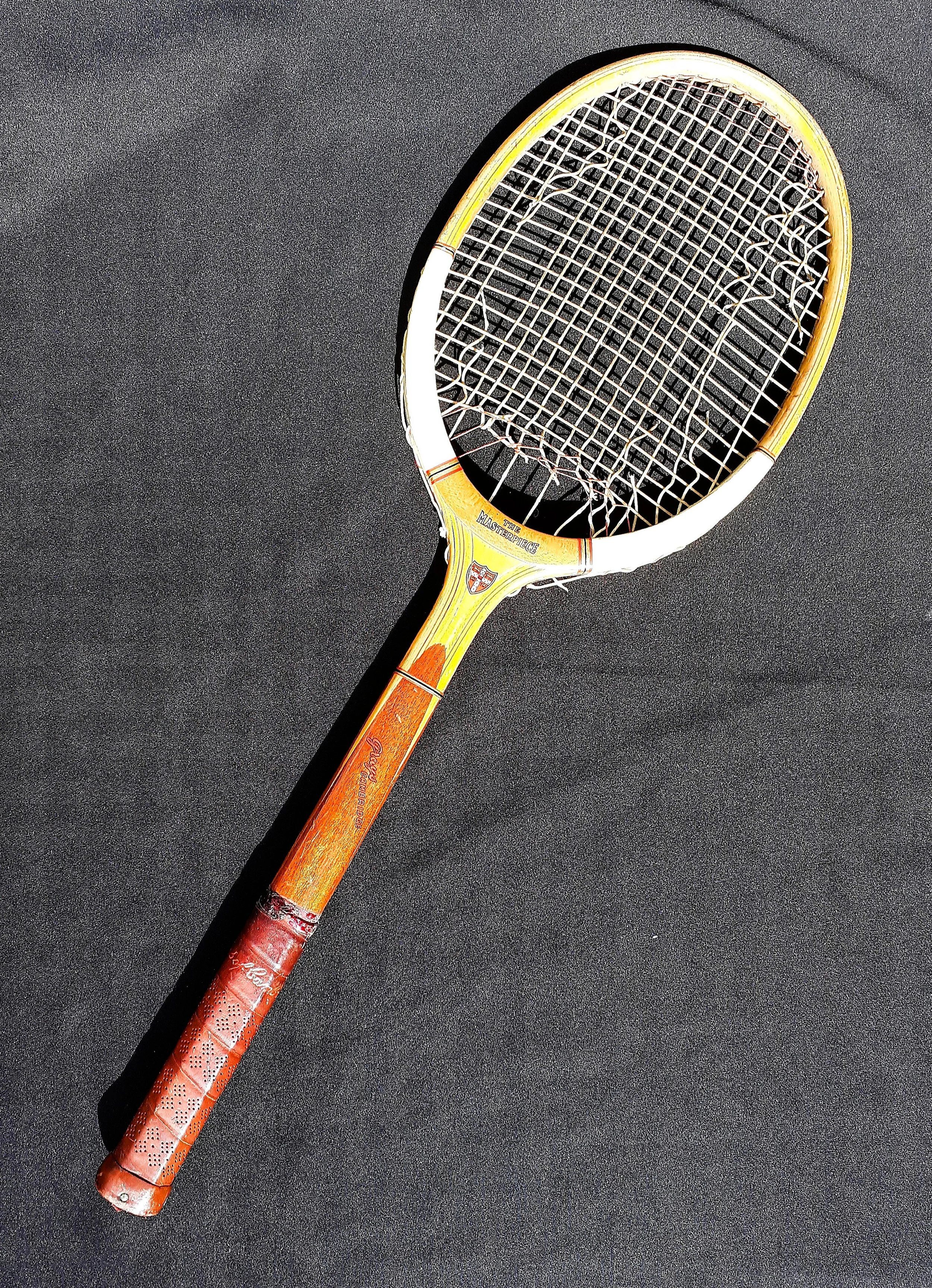 Full length heritage Grays racket against a black background.