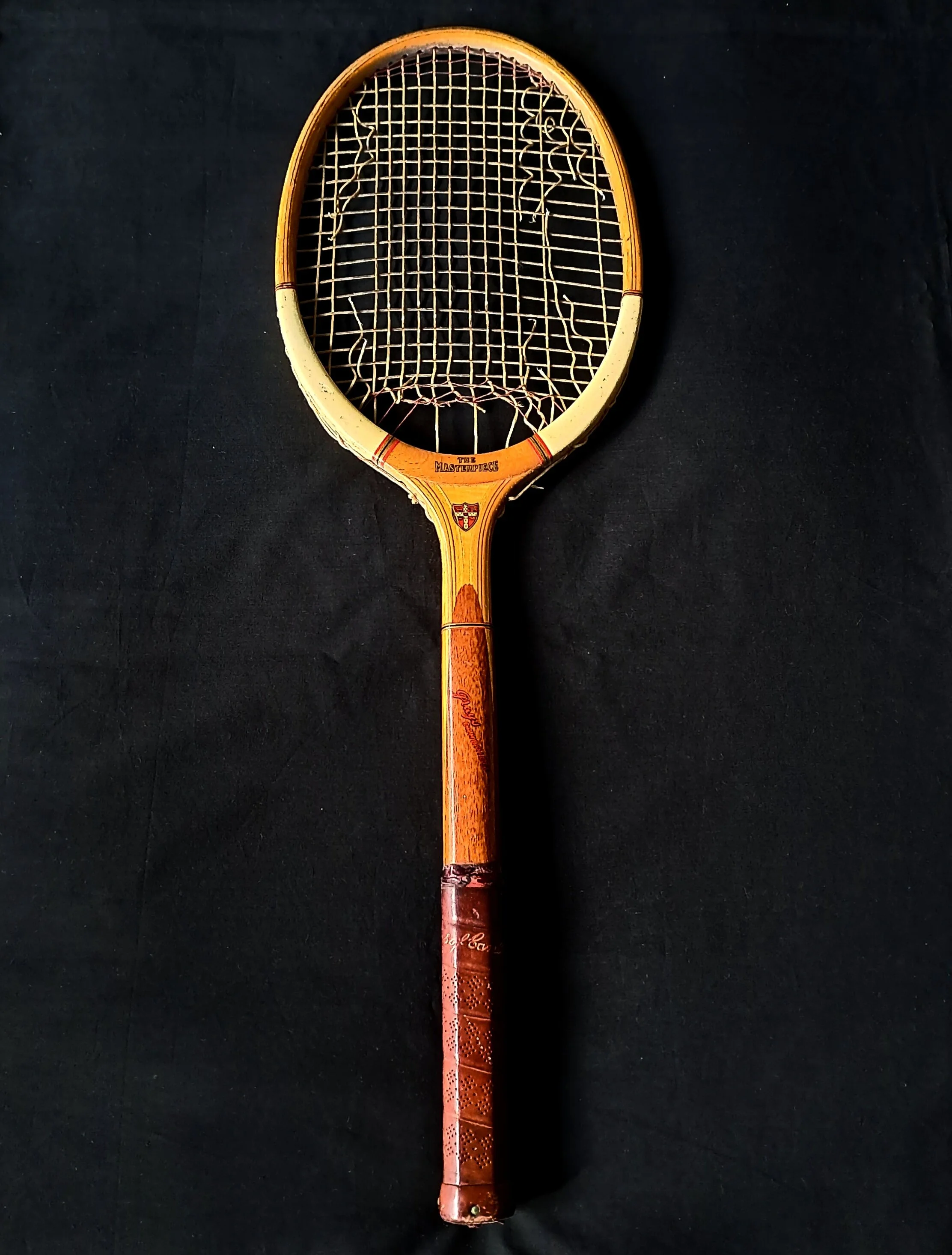 Grays The Masterpiece tennis racket against black background.
