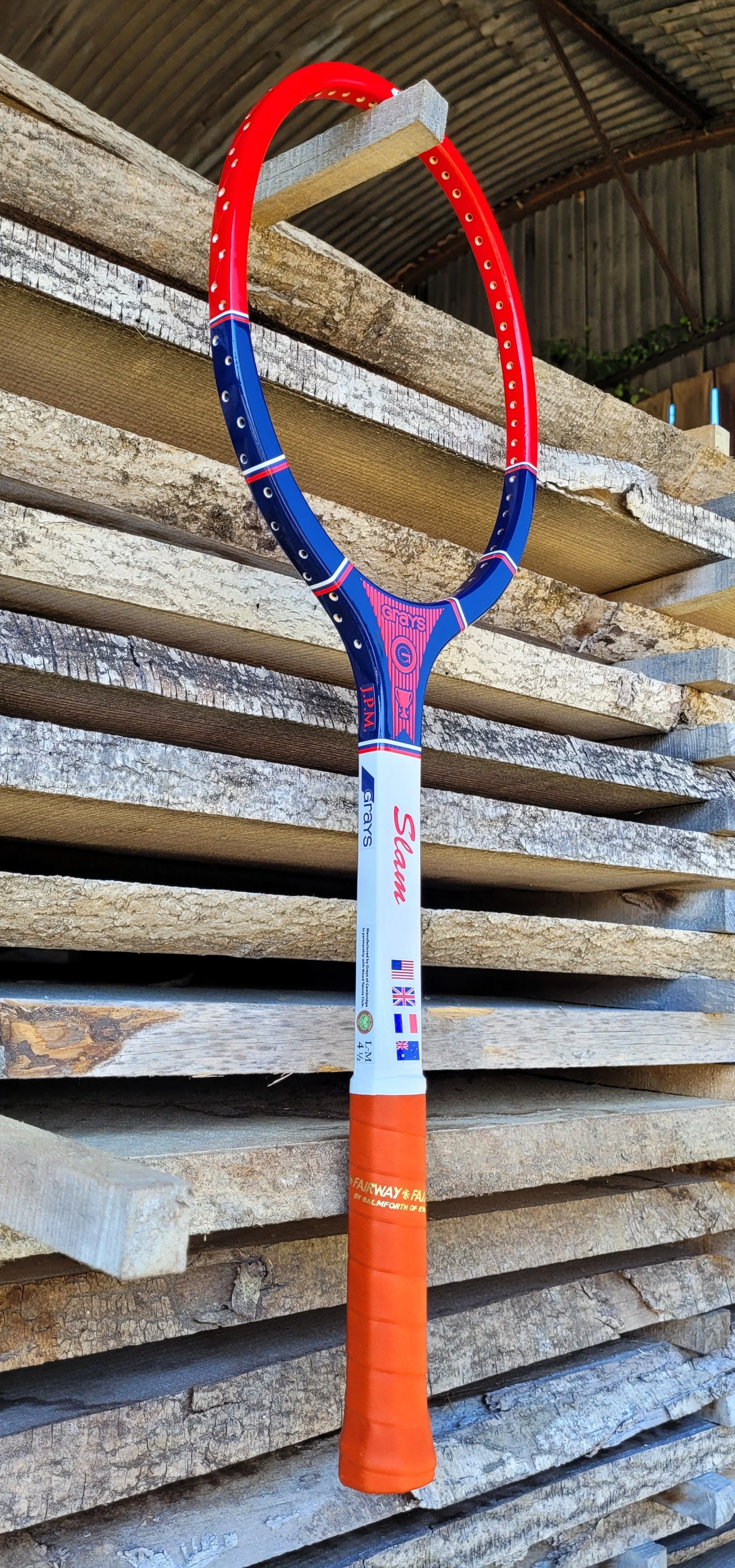 Grays Slam frame hanging against a wood background.