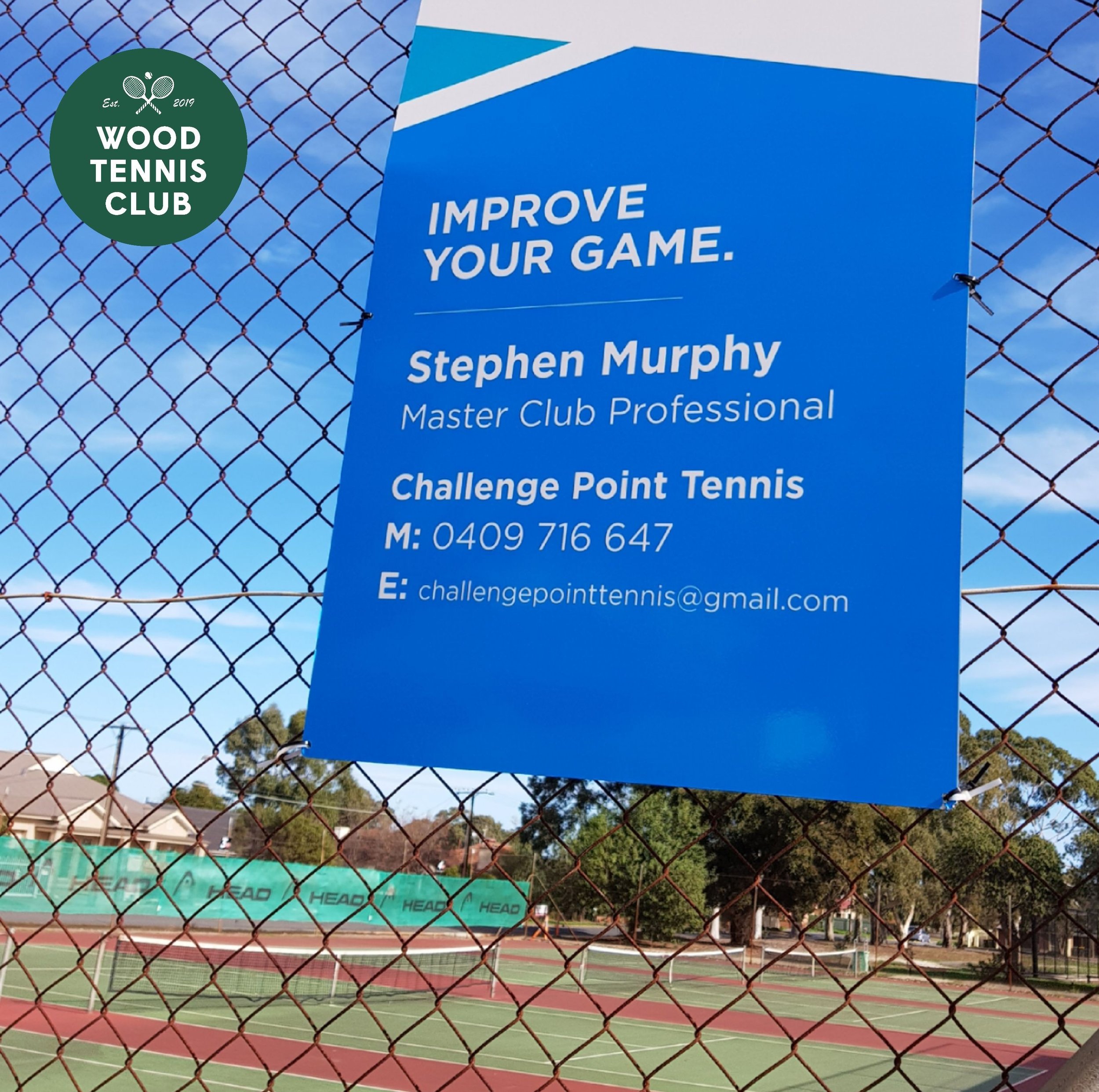 Coaching sign on fence of tennis club.
