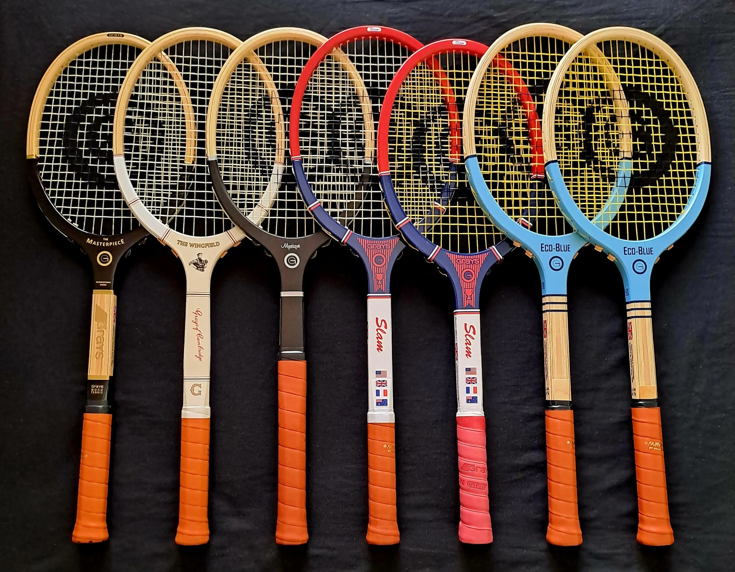 seven Grays rackets together against a black background
