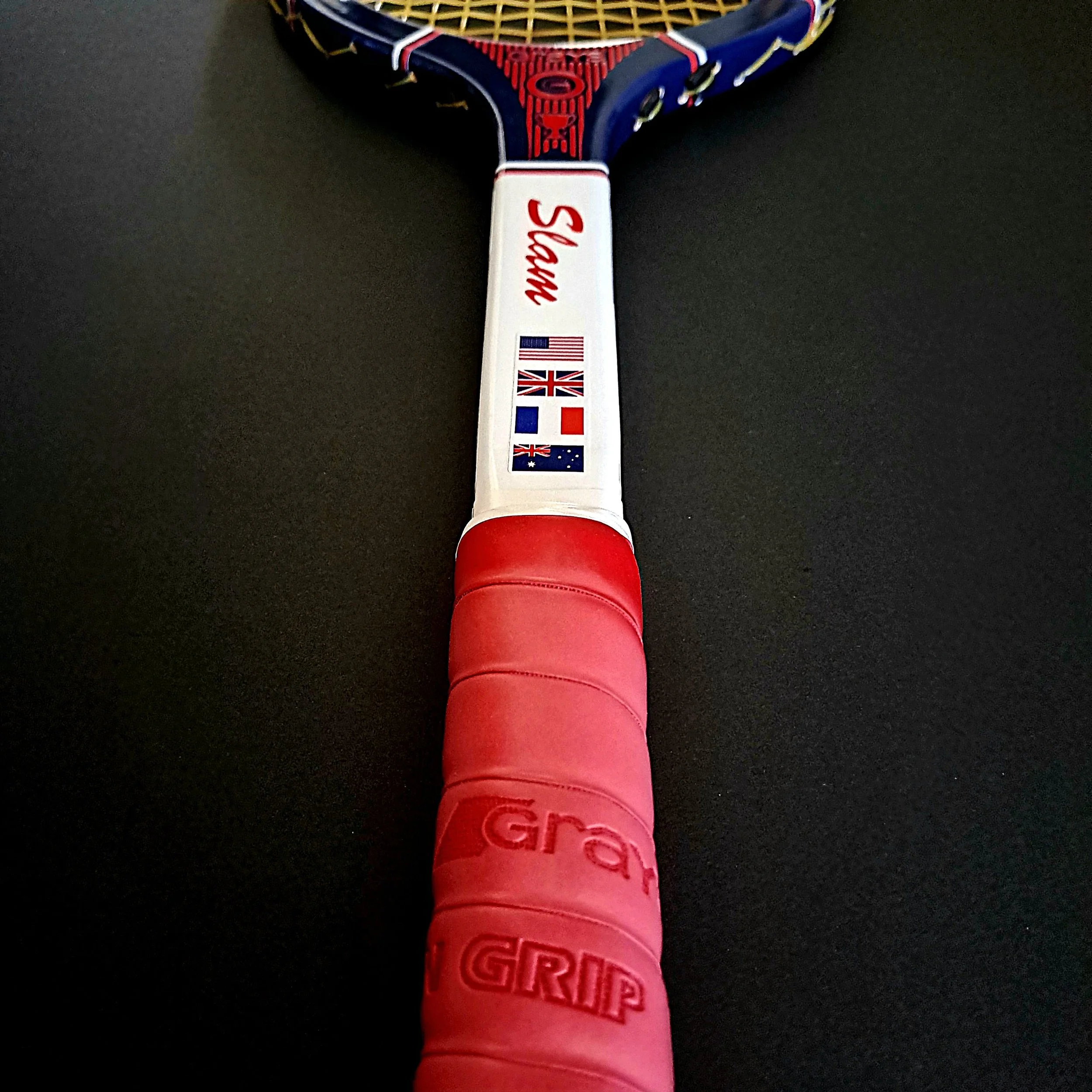 Junior Slam with pink cushion grip against a black background.