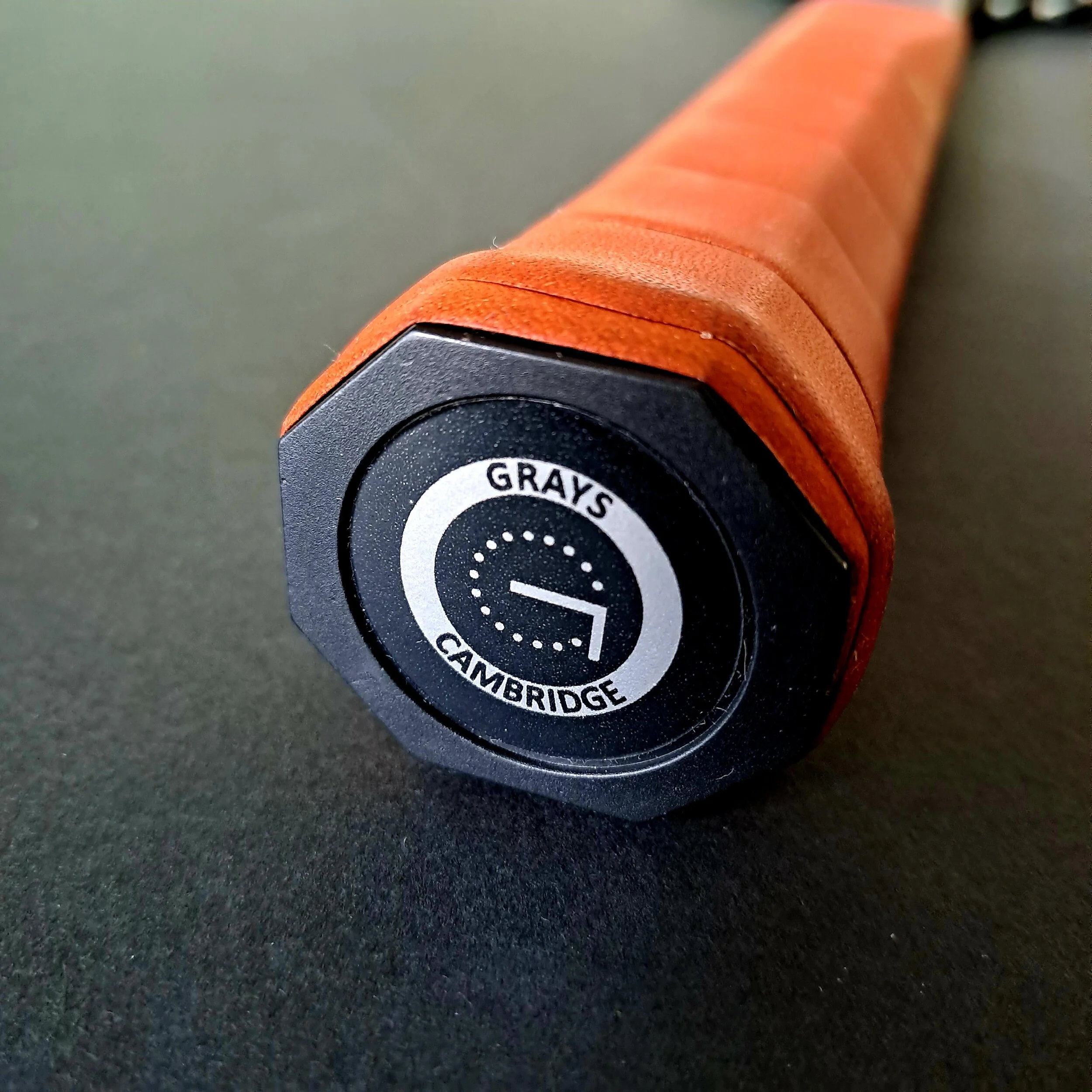 Close-up of Grays Mystique end cap and grip showing Grays label.