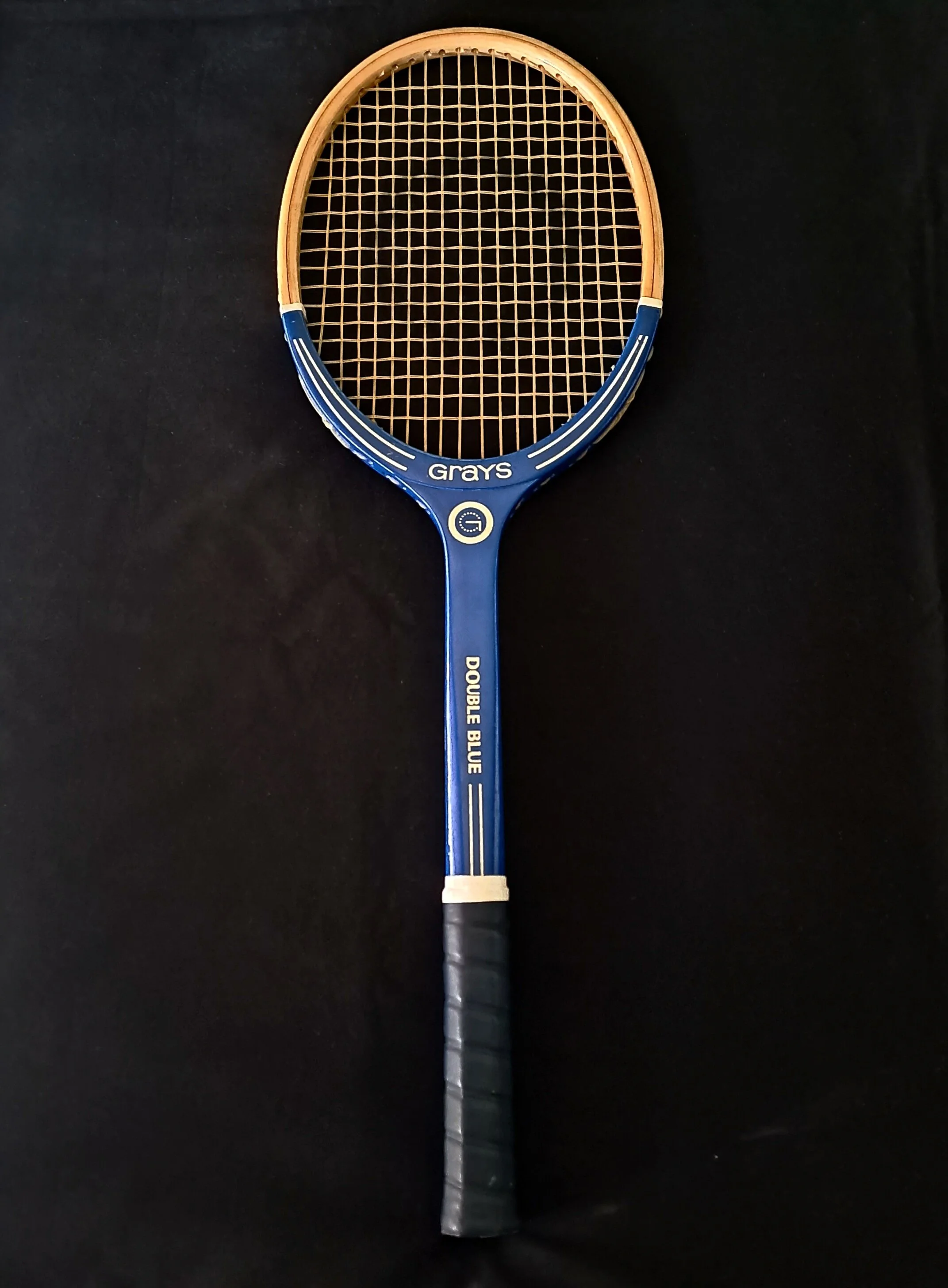 Heritage Grays racket against a black background.