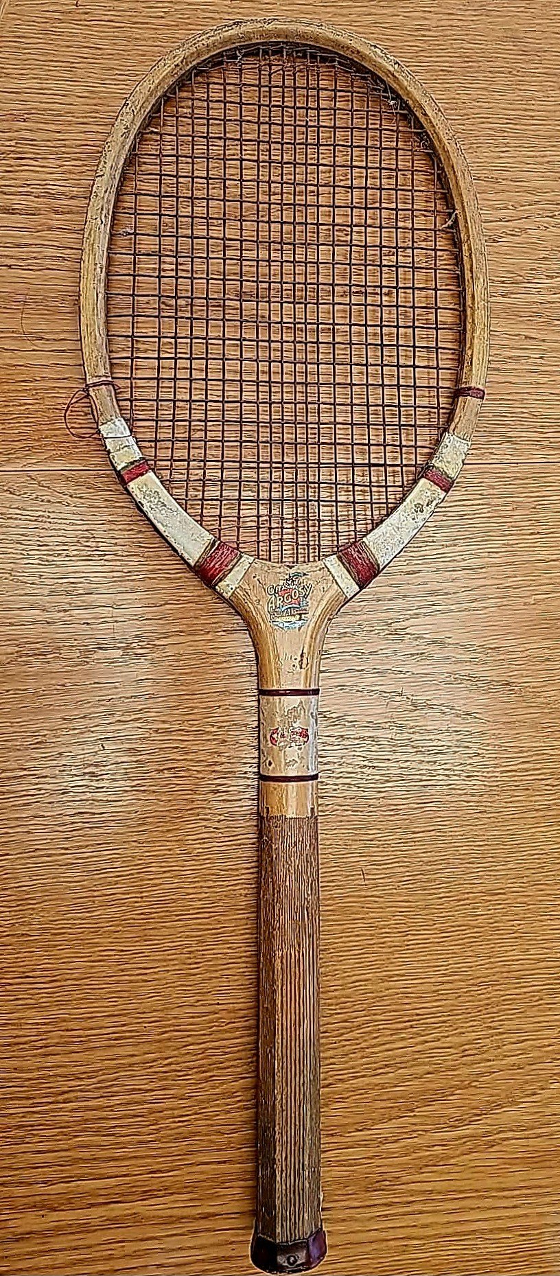 vintage wood racket against a timber background