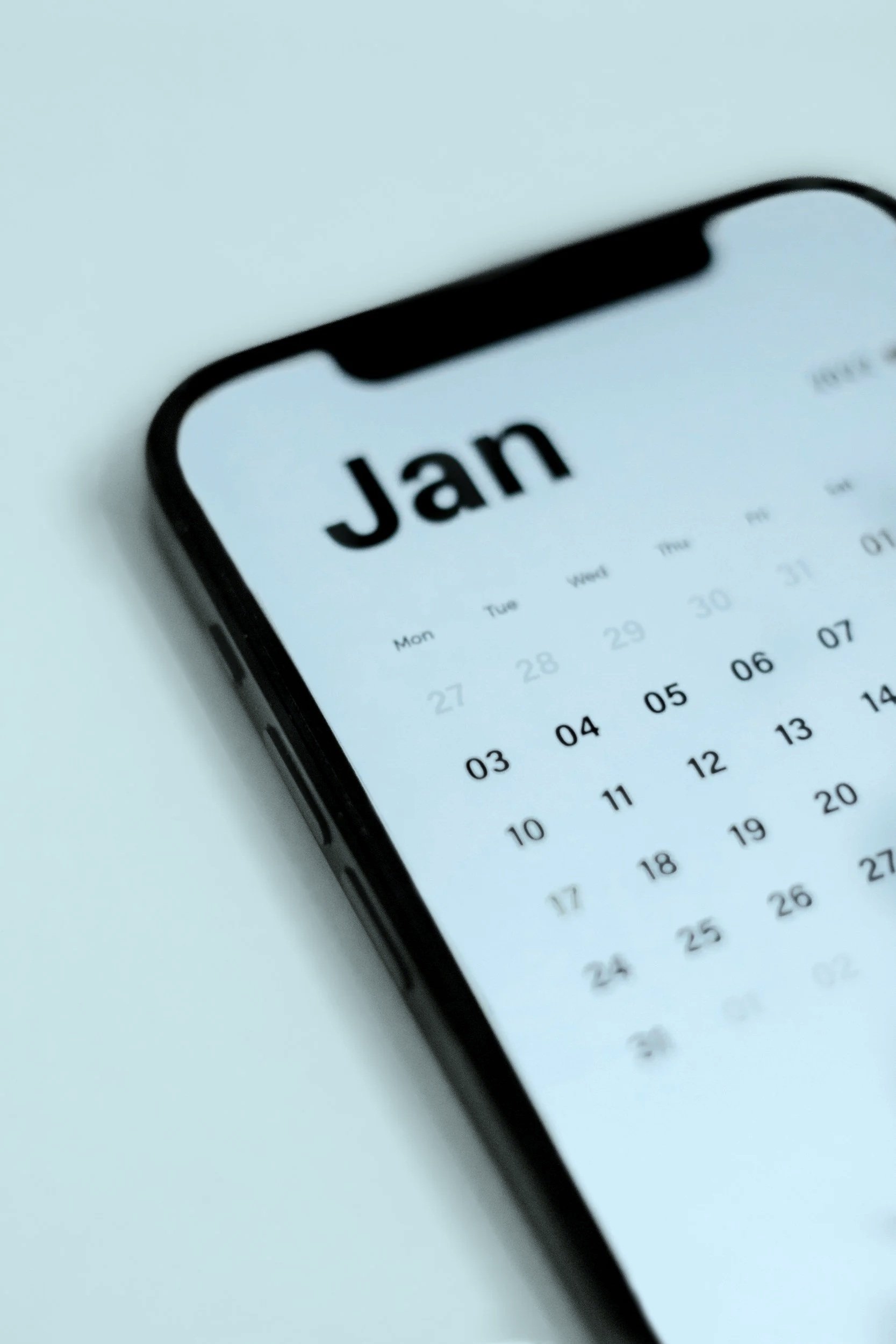 Close-up of a smartphone displaying a calendar for January.