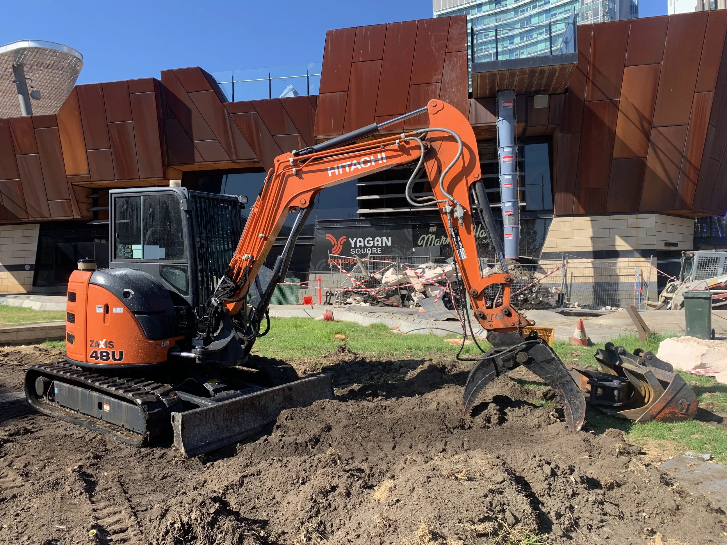 mini excavator doing earthworks in Perth city