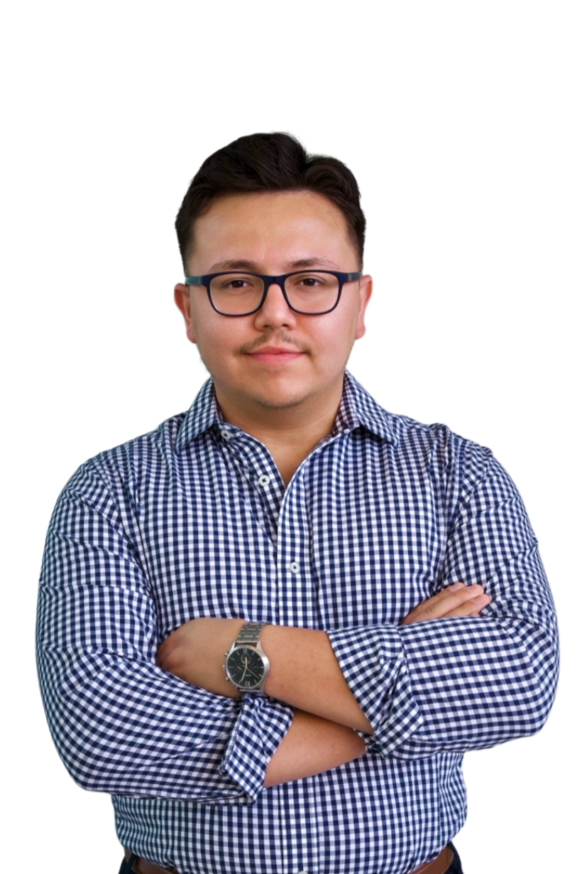 A young male business broker with arms crossed confidently smiling.