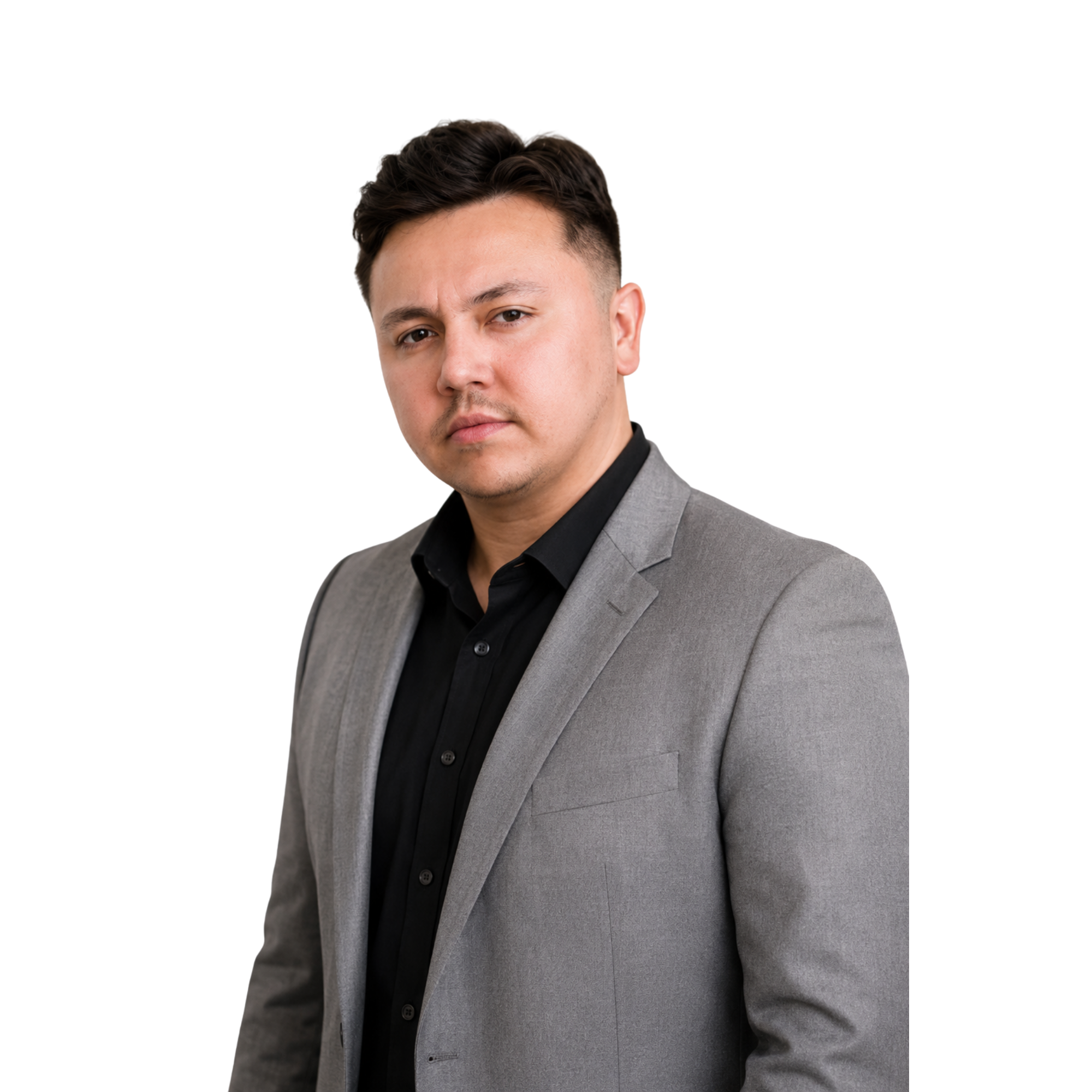 Man in a suit standing at an angle looking at you confidently