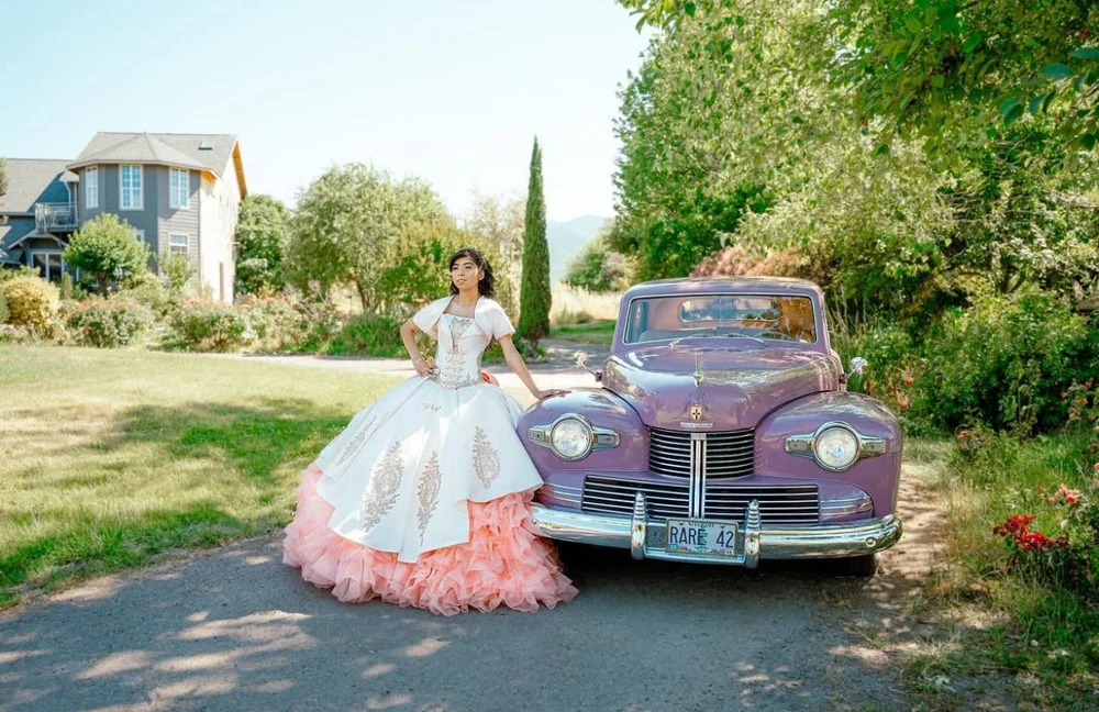 Quinceañera with a classic car