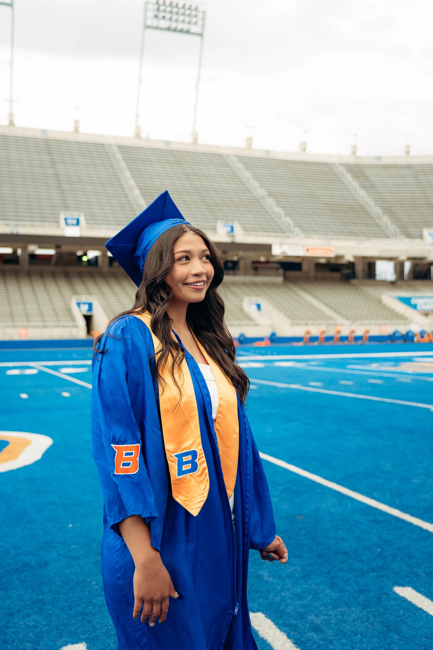 Graduate on the blue turf at Boise State