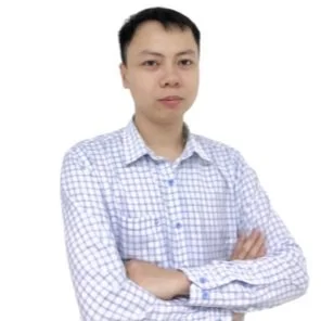 Man in checkered shirt with arms crossed