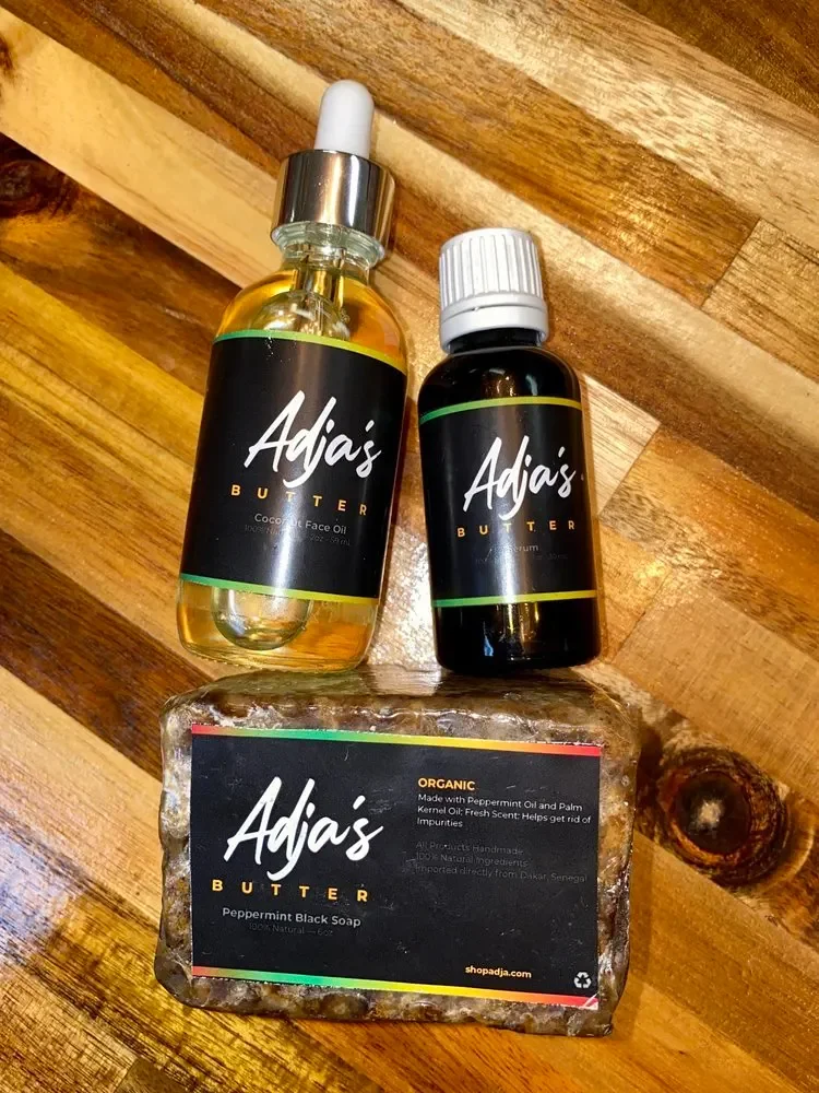 Adja’s body oils on a wooden table