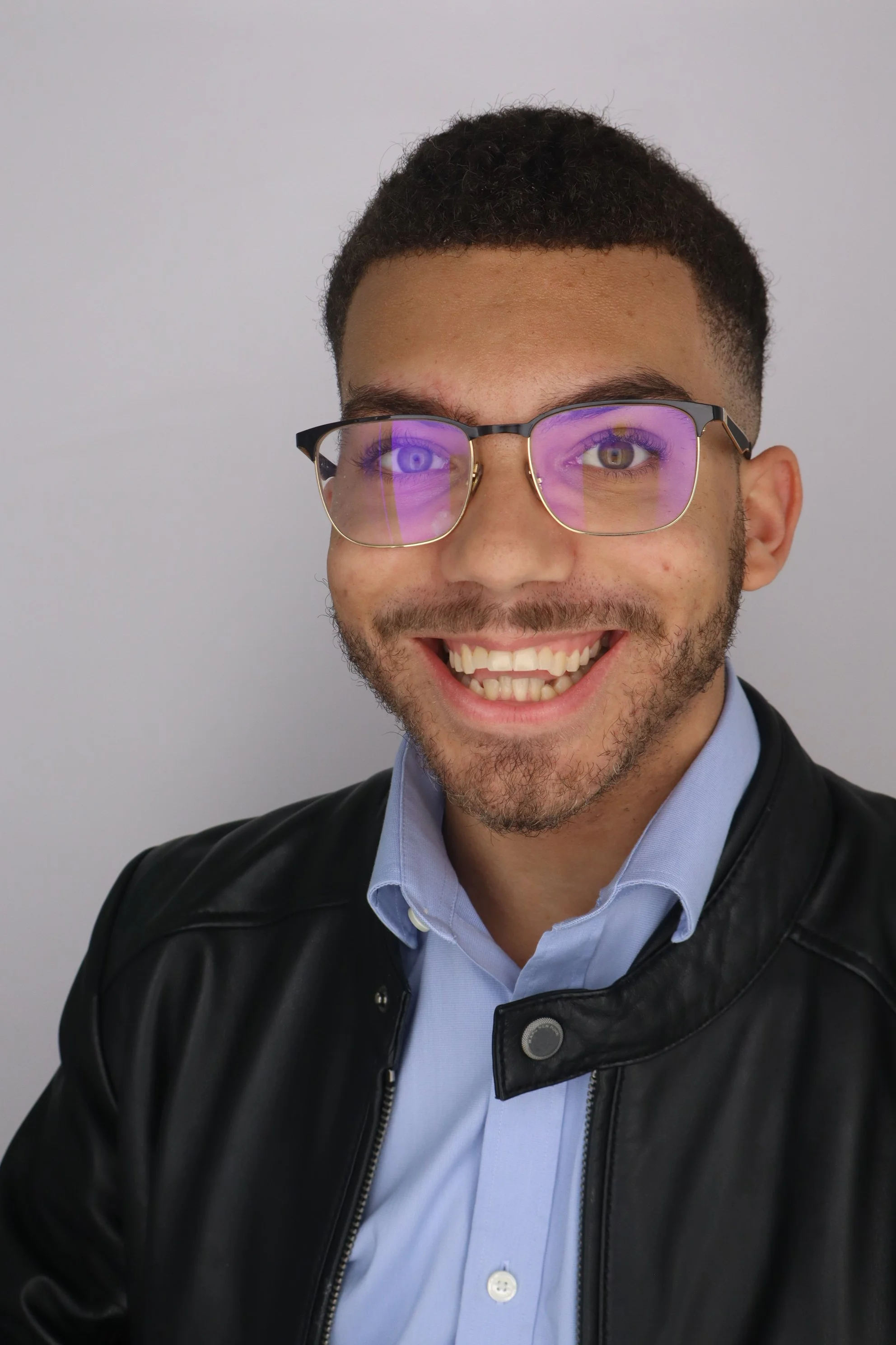 Photo of Alli Jablonski, a white women, wearing glasses and a grey sweatshirt
