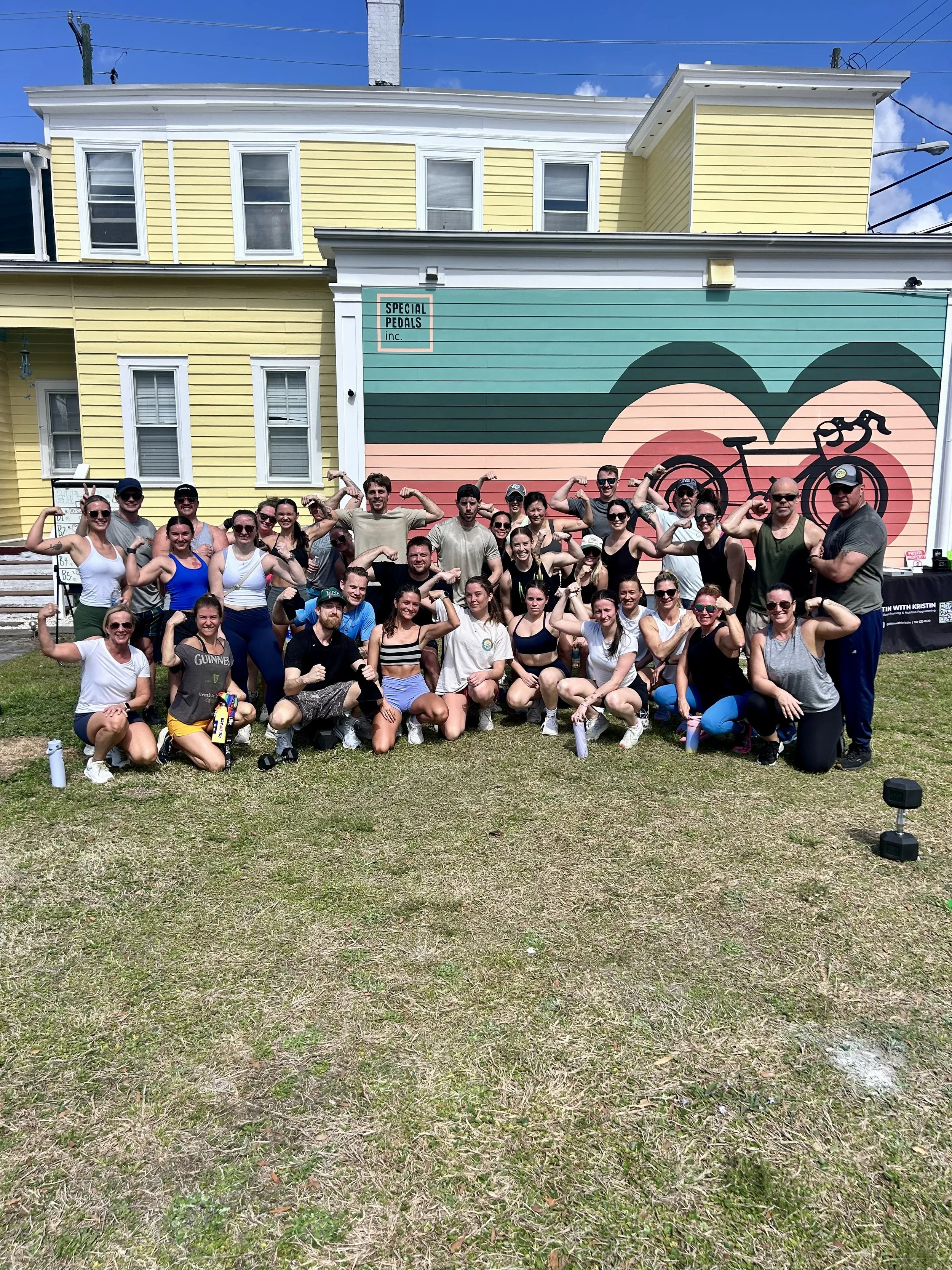 Pedal to the Metal workout Crew flexing after a great workout benefiting Special Pedals. 