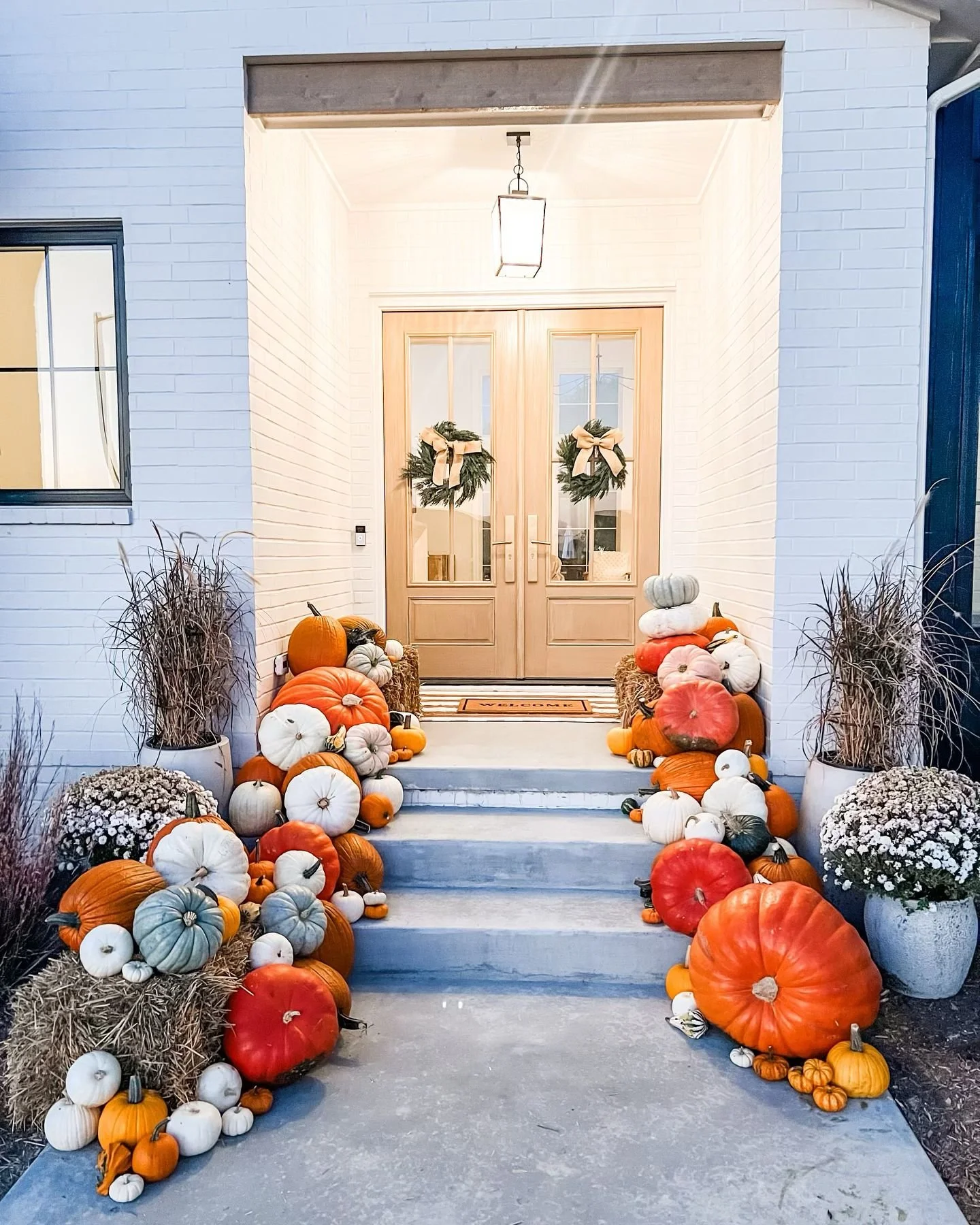 BEFORE & AFTER! Check out this gorgeous house now adorned with piles of perfect pumpkins!