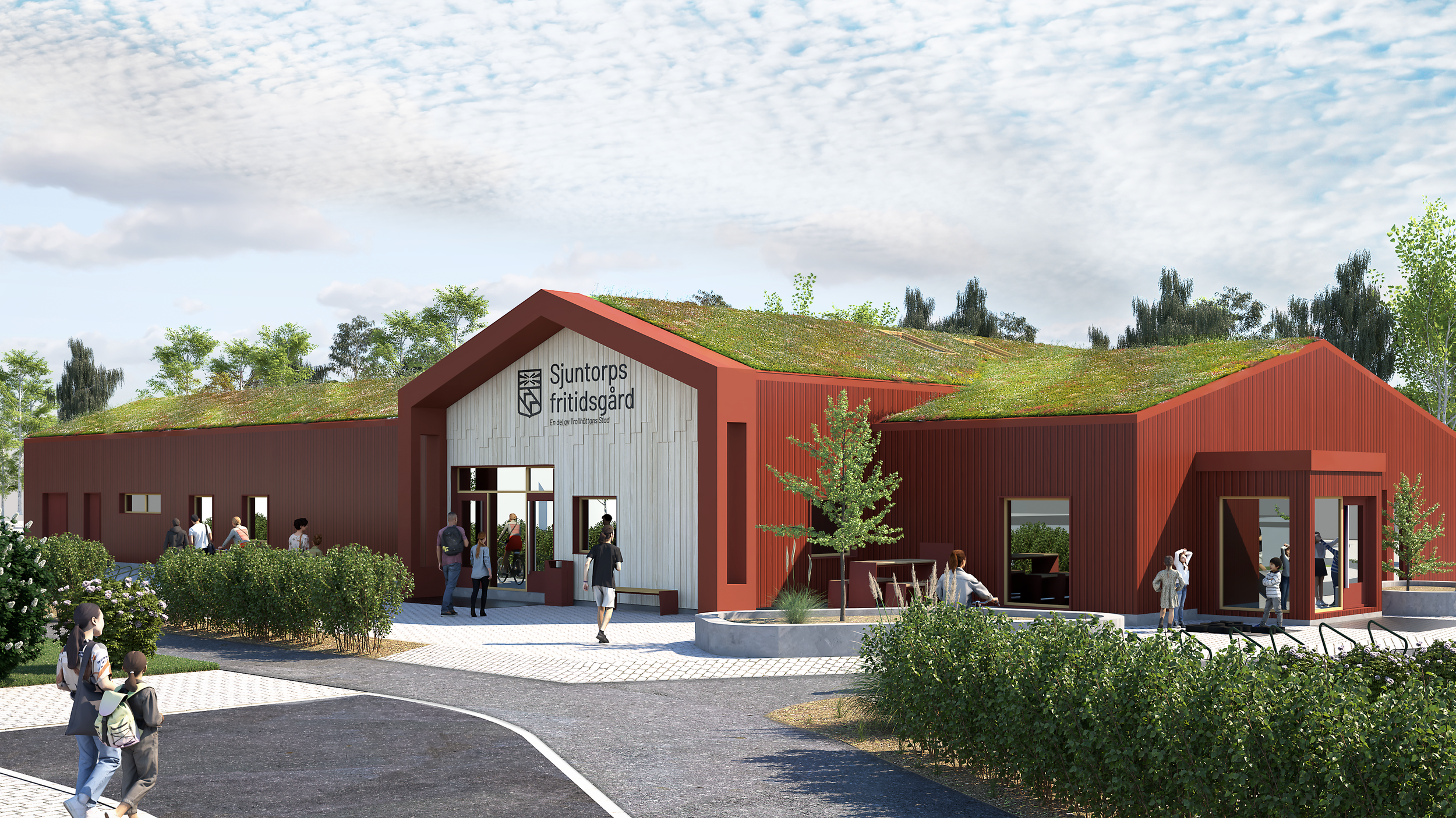 Modern byggnad med grön tak, skylt som säger 'Sjuntorps fritidsgård' och flera personer utanför, omgiven av gröna buskar och träd, på en molnig dag.