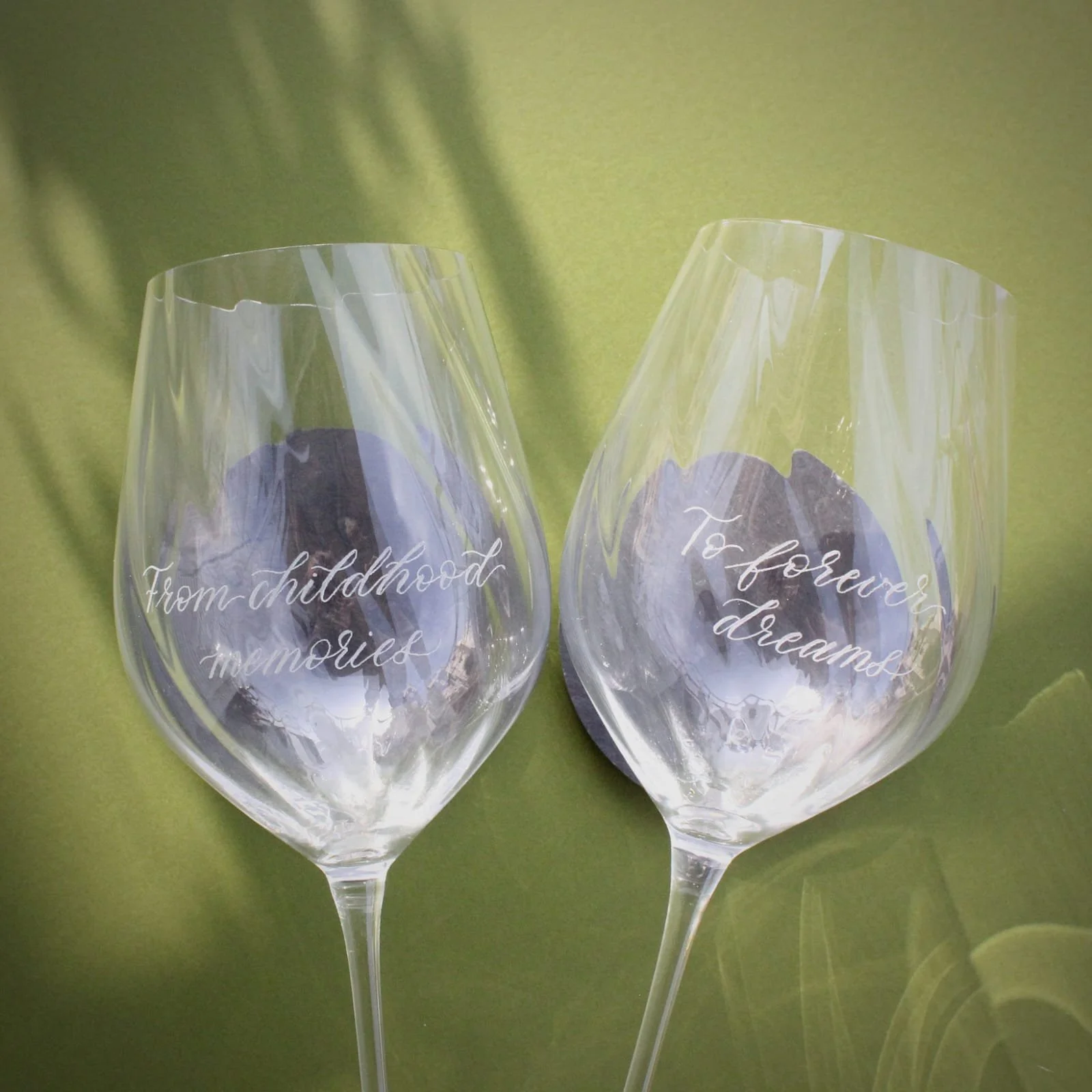 Engraving by hand live events brand activation. Engraved wine glasses