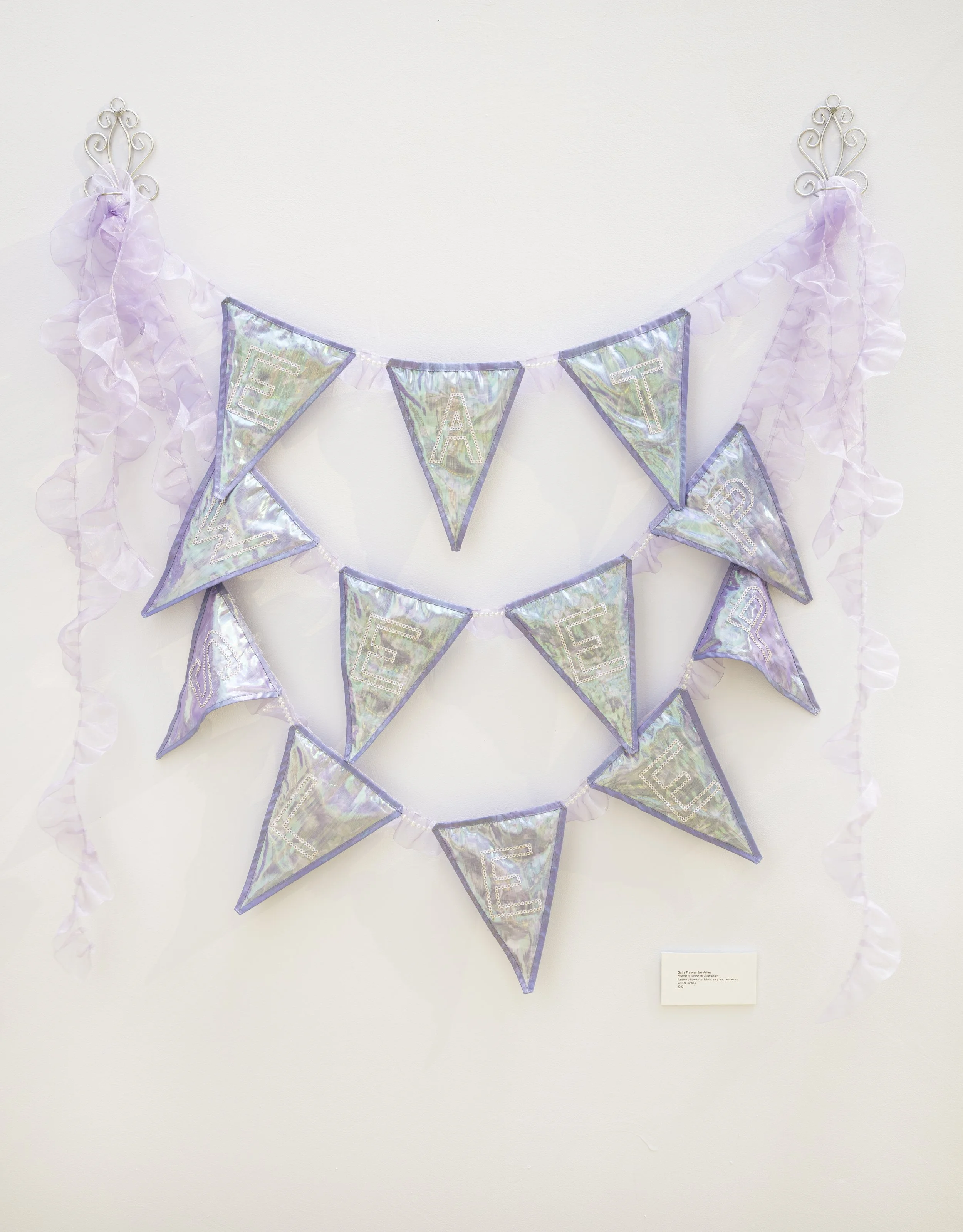 "Repeat (Score for Slow Grief) | Pillow Case, Satin Ribbon, Hand-stitched Sequins, Organza | 4ft x 4ft // Text Reads: "Eat" "Weep" "Sleep"